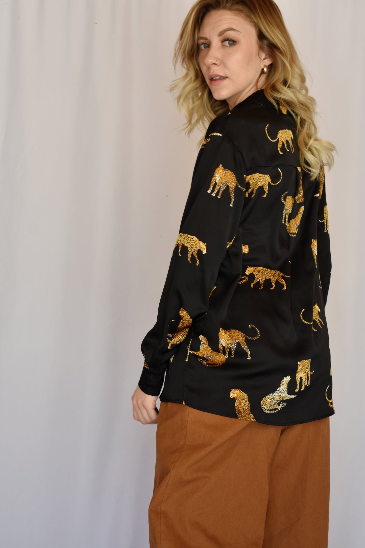 black satin button down with print of small cheetahs all over it button cuffs