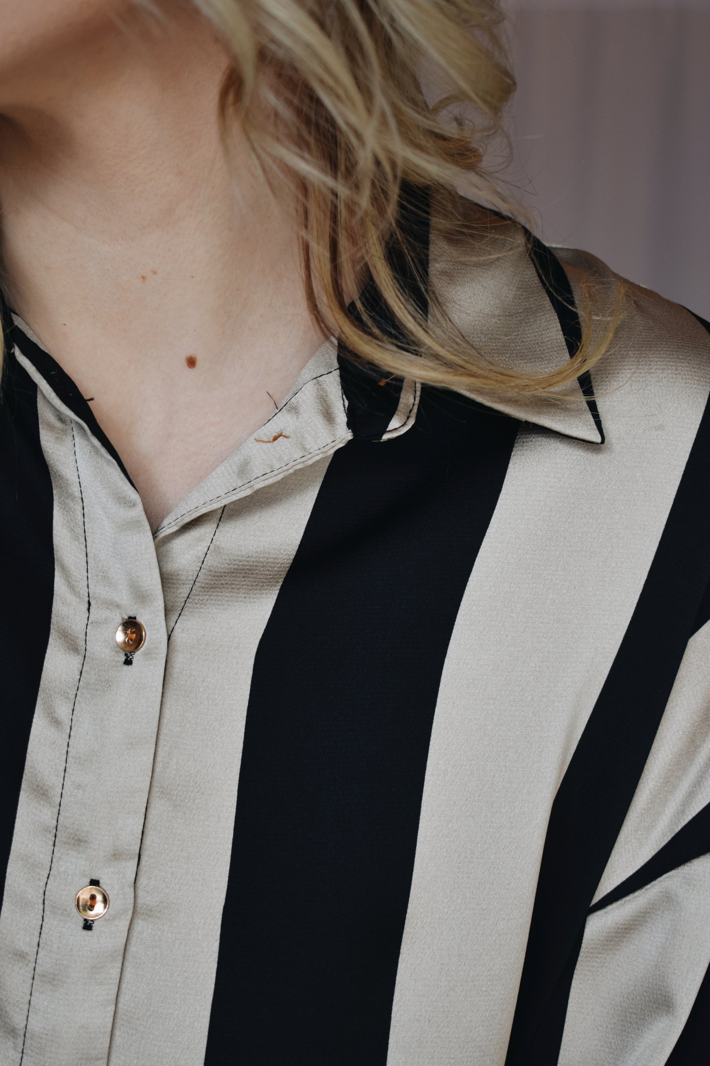black and light tan striped satin button down slightly oversized button cuffs drop shoulders high low hem