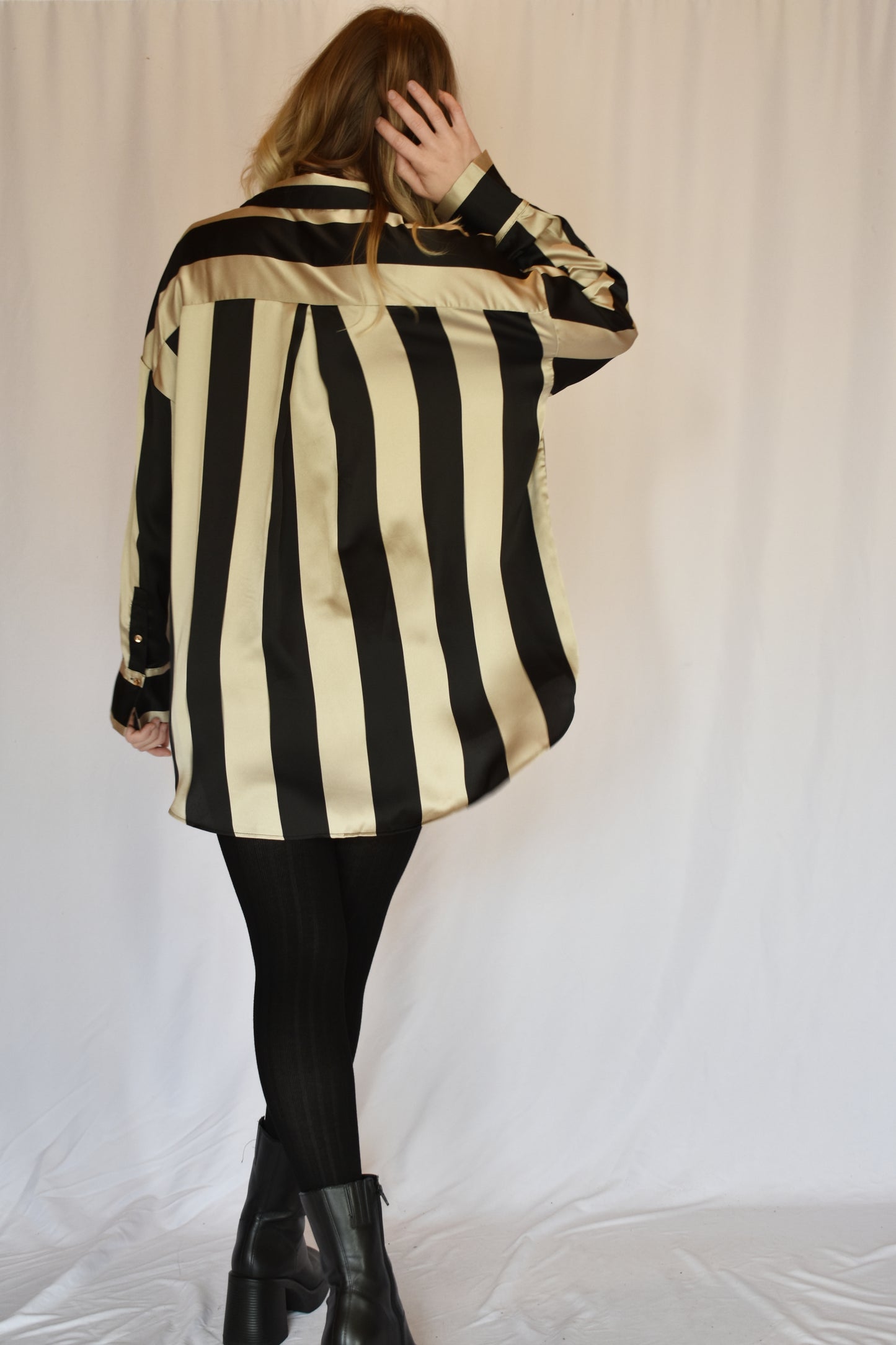 black and light tan striped satin button down slightly oversized button cuffs drop shoulders high low hem