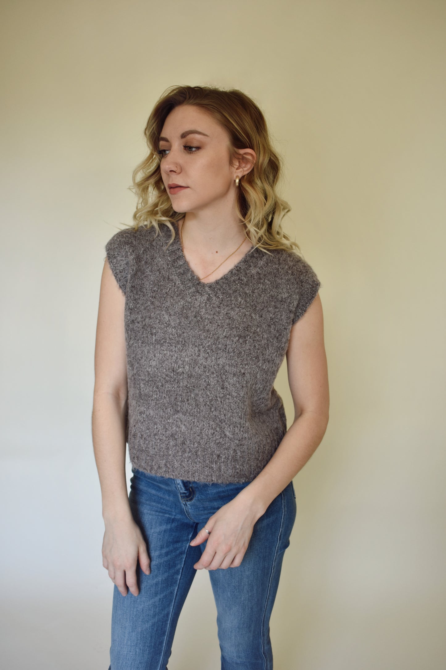 V neck sweater vest - slightly cropped, loose fit. Wide ribbed detail on neckline, sleeves and hem. mocha colored.