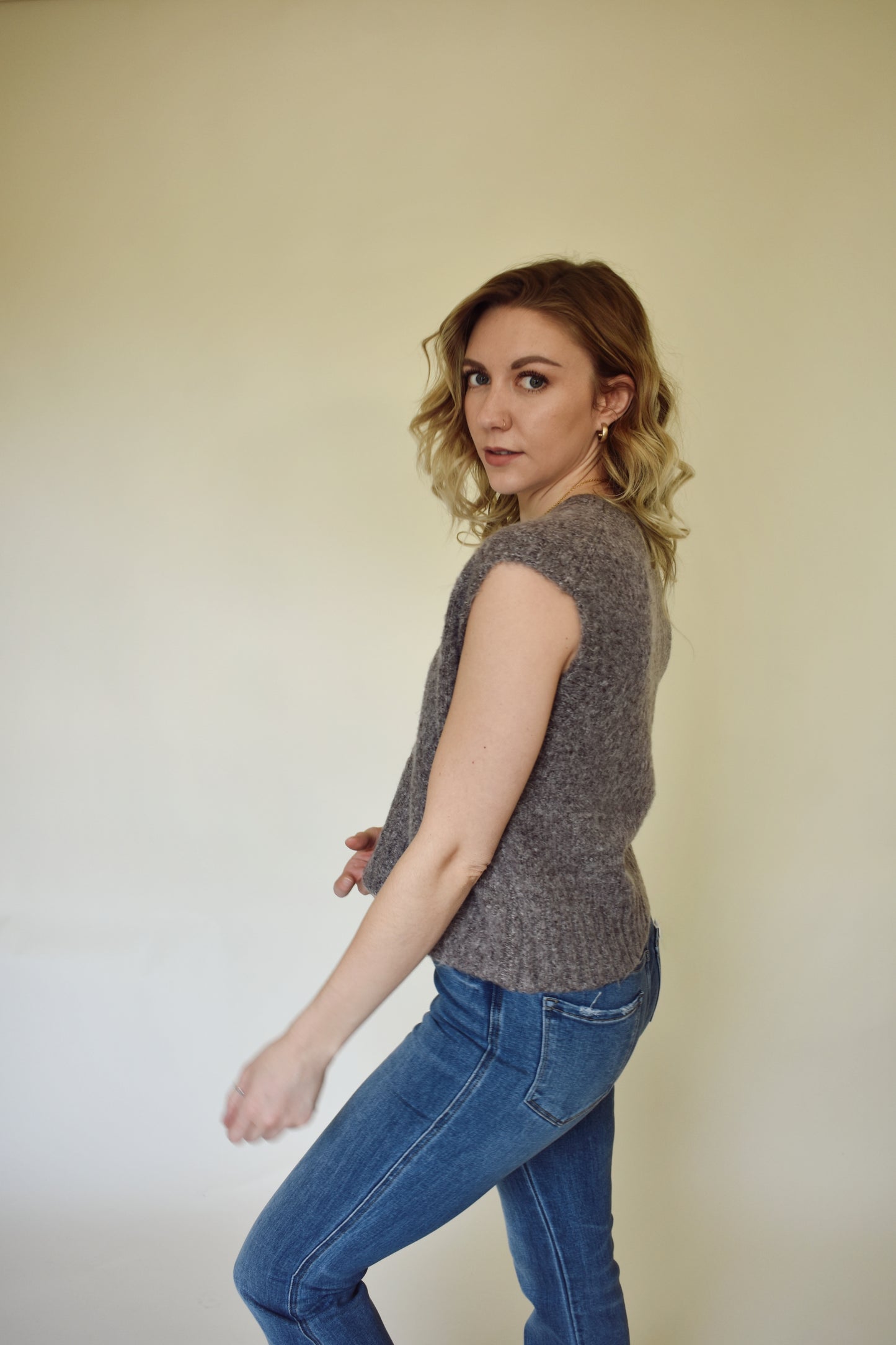 V neck sweater vest - slightly cropped, loose fit. Wide ribbed detail on neckline, sleeves and hem. mocha colored.