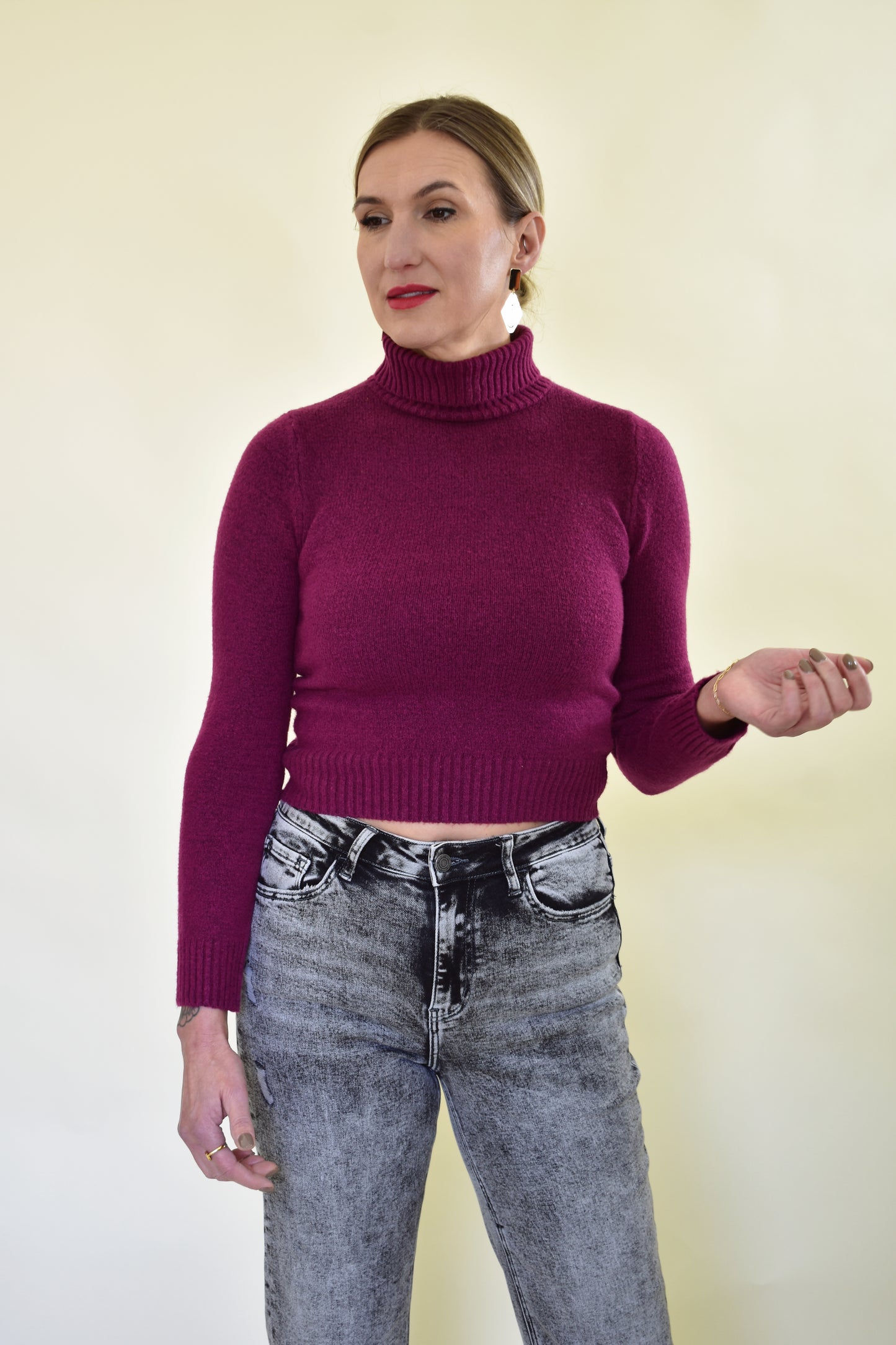 purple turtleneck fitted sweater with thick ribbed hem and cuffs