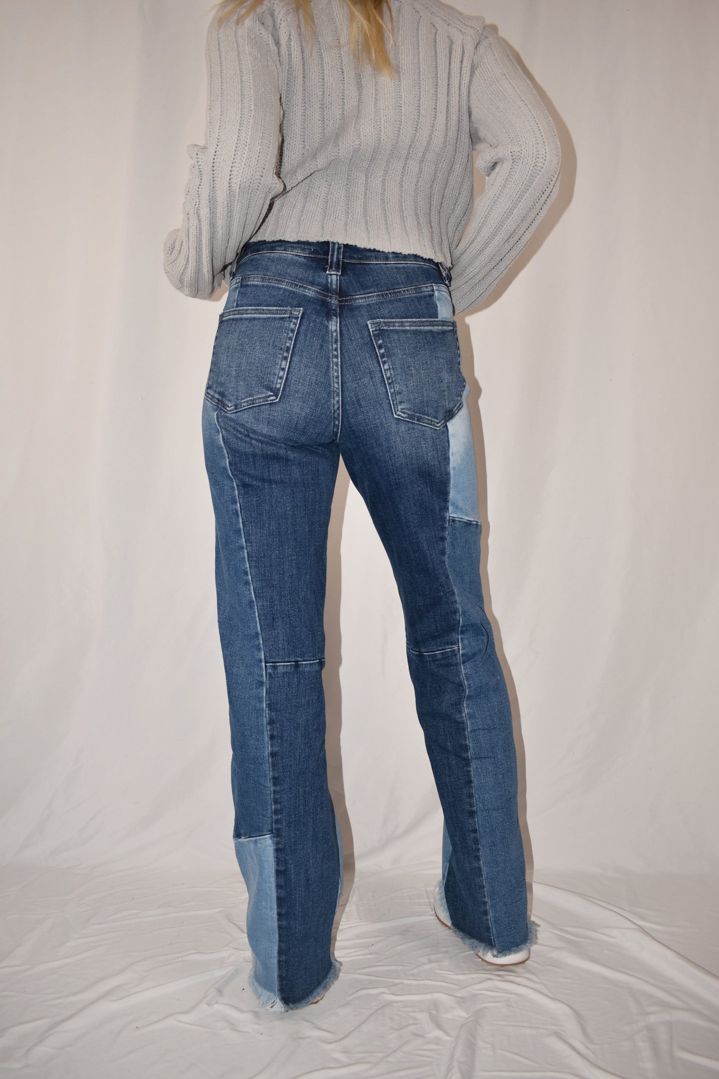boyfriend/straight leg style jeans with stretch denim. Patchwork style ranging from medium to light wash. frayed hem, full length.