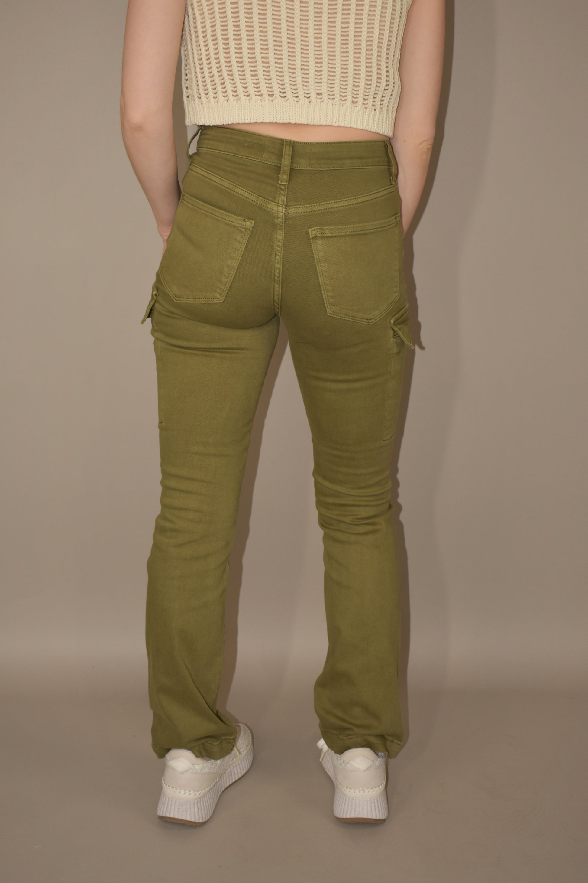straight legged olive colored stretch denim with side cargo pockets flap enclosure front and back pockets no holes