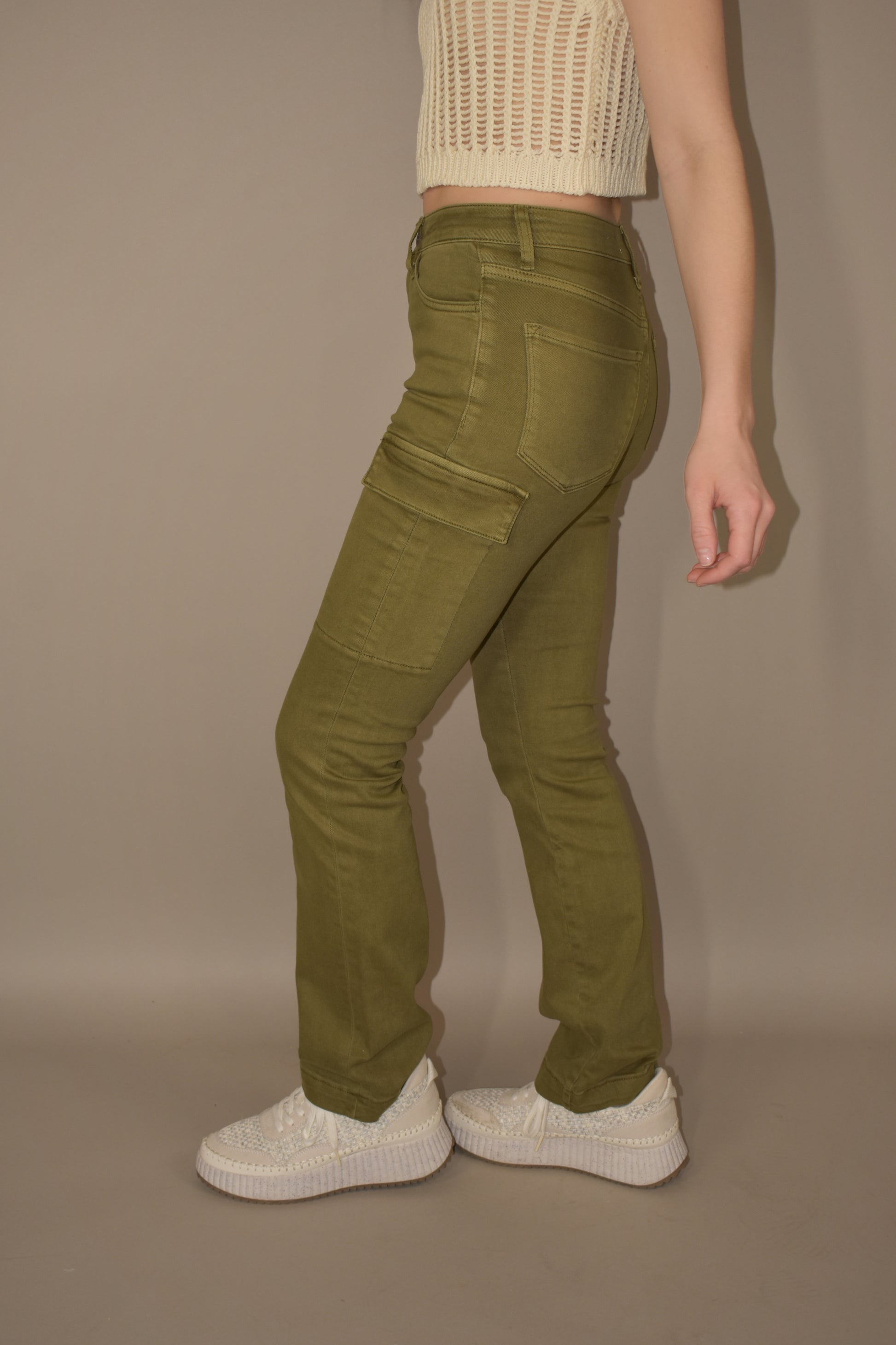 straight legged olive colored stretch denim with side cargo pockets flap enclosure front and back pockets no holes