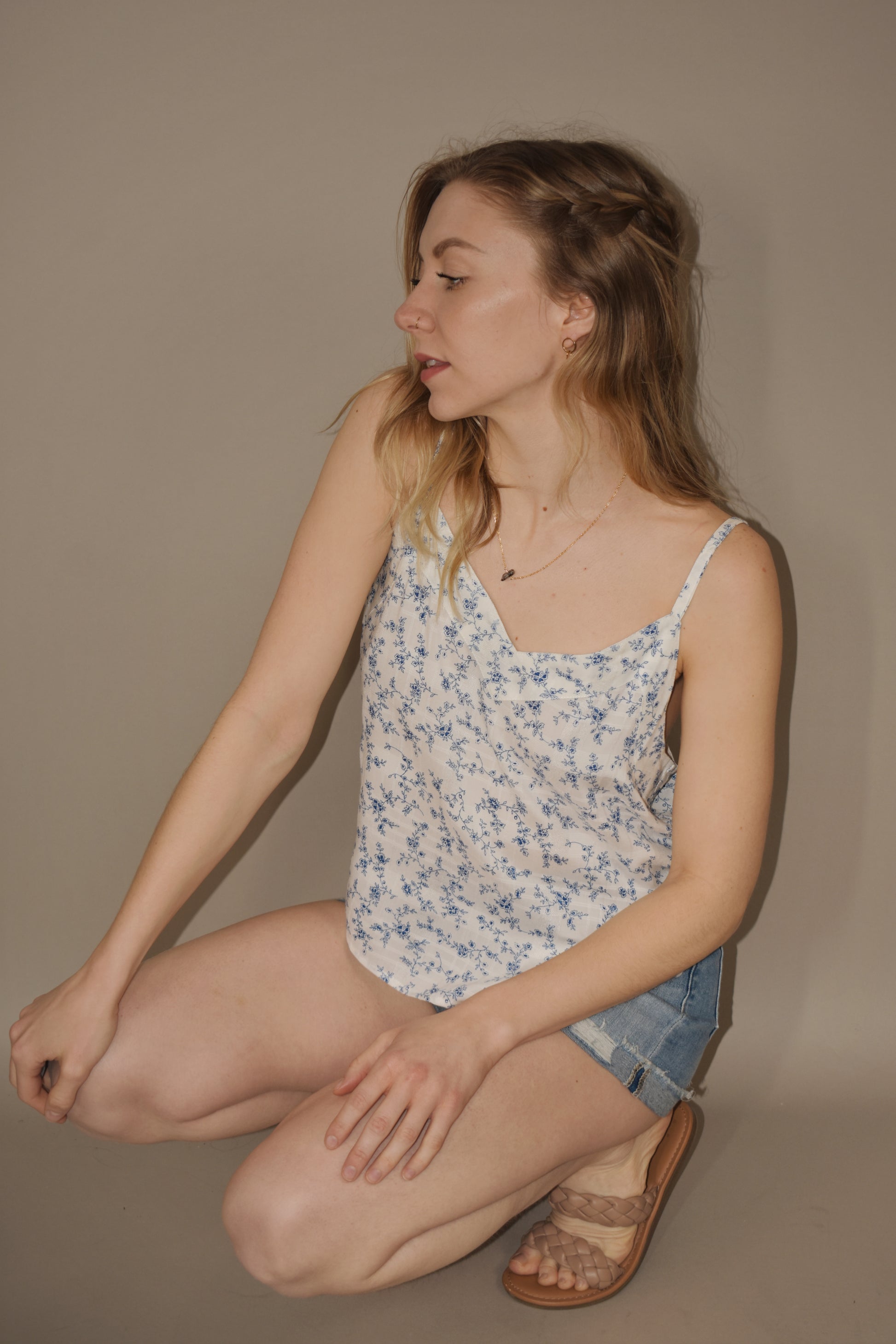 full length loose fitting white cami with dainty blue floral print. adjustable spaghetti straps and v neck.
