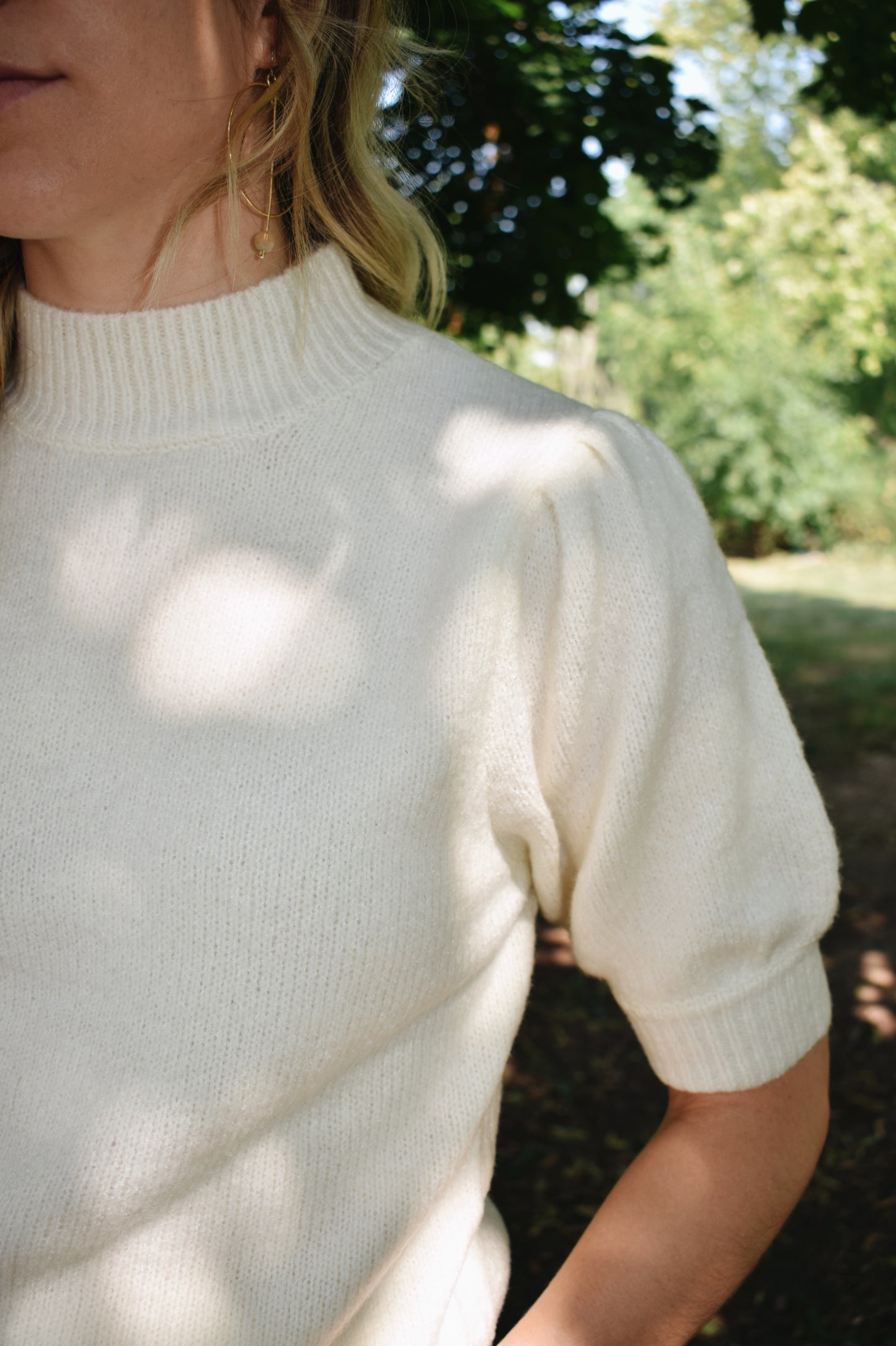 Cream mod neck short puff sleeve sweater with a tailored fit with a ribbed neck and cuffs. Sleeves hit just above the elbow.