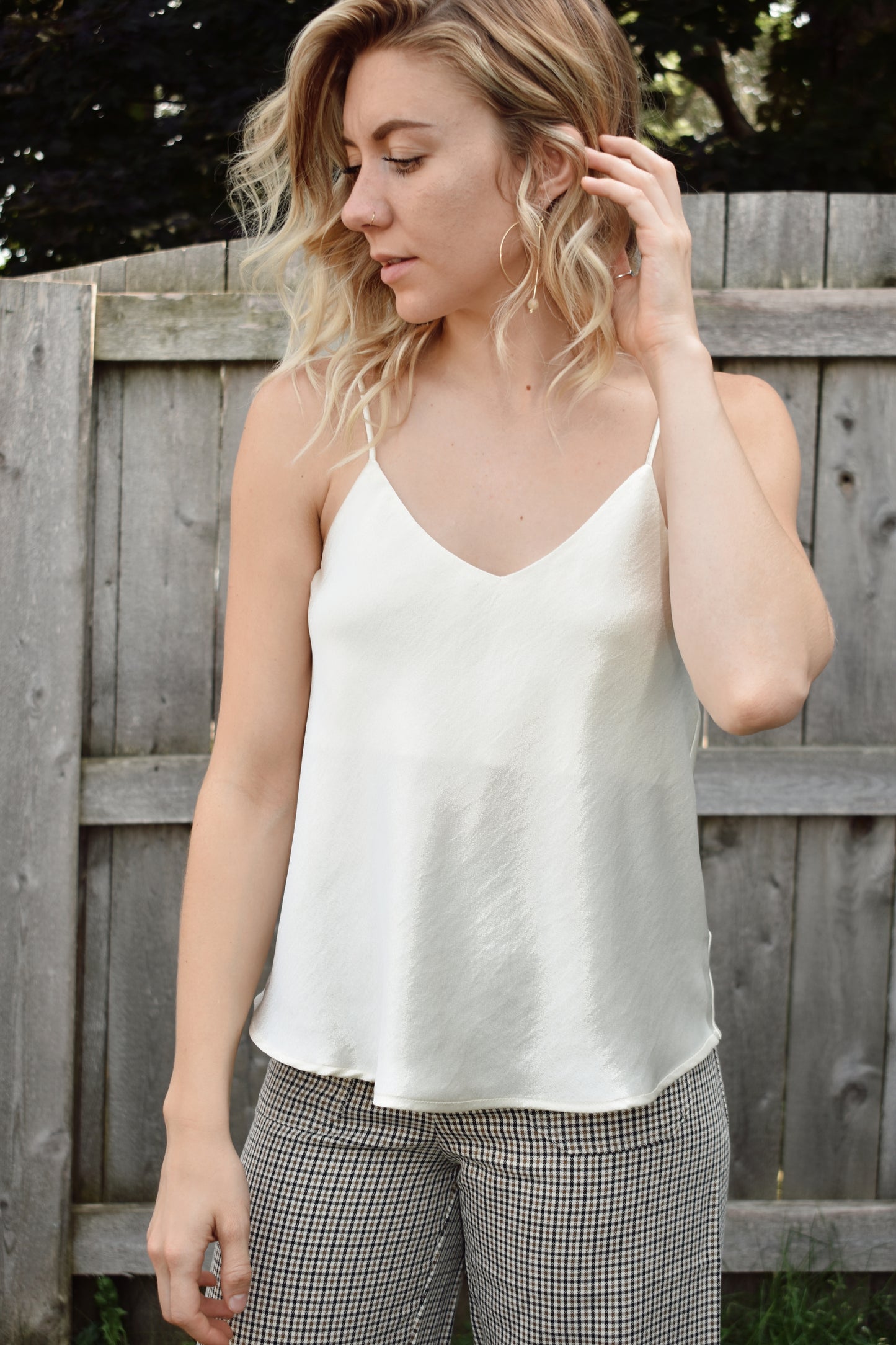 Ivory metallic sheen full length cami with adjustable spaghetti straps and a V neckline in the front and in the back