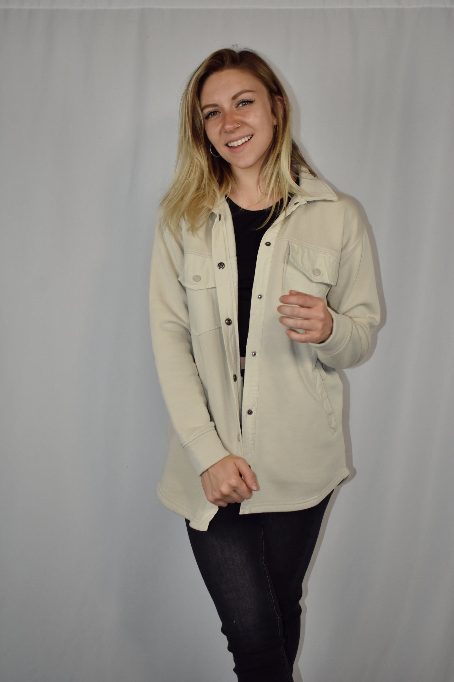 snap button down cozy shacket with two breast pockets, longline silhouette and slightly oversized fit.