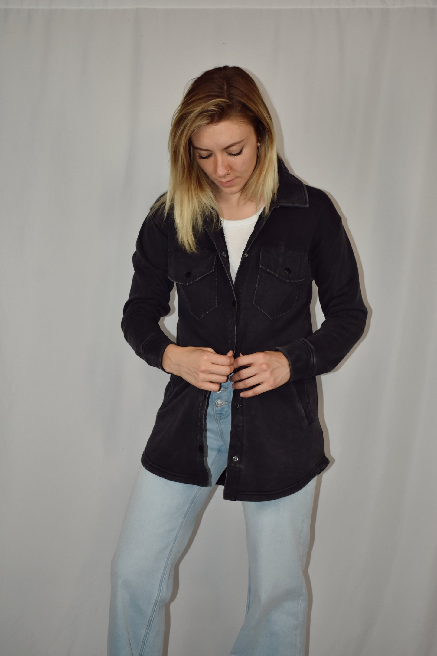 snap button down cozy shacket with two breast pockets, longline silhouette and slightly oversized fit.