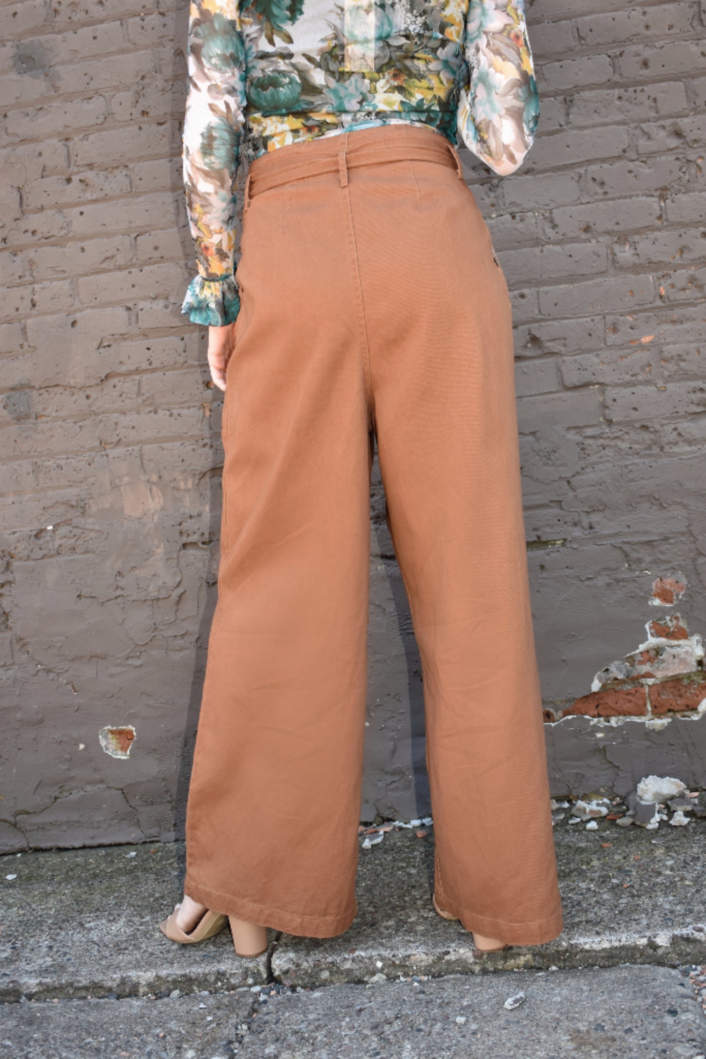 Light brown high waisted twill pants with wide legs, tie belt, side pockets, paper bag style on waistline