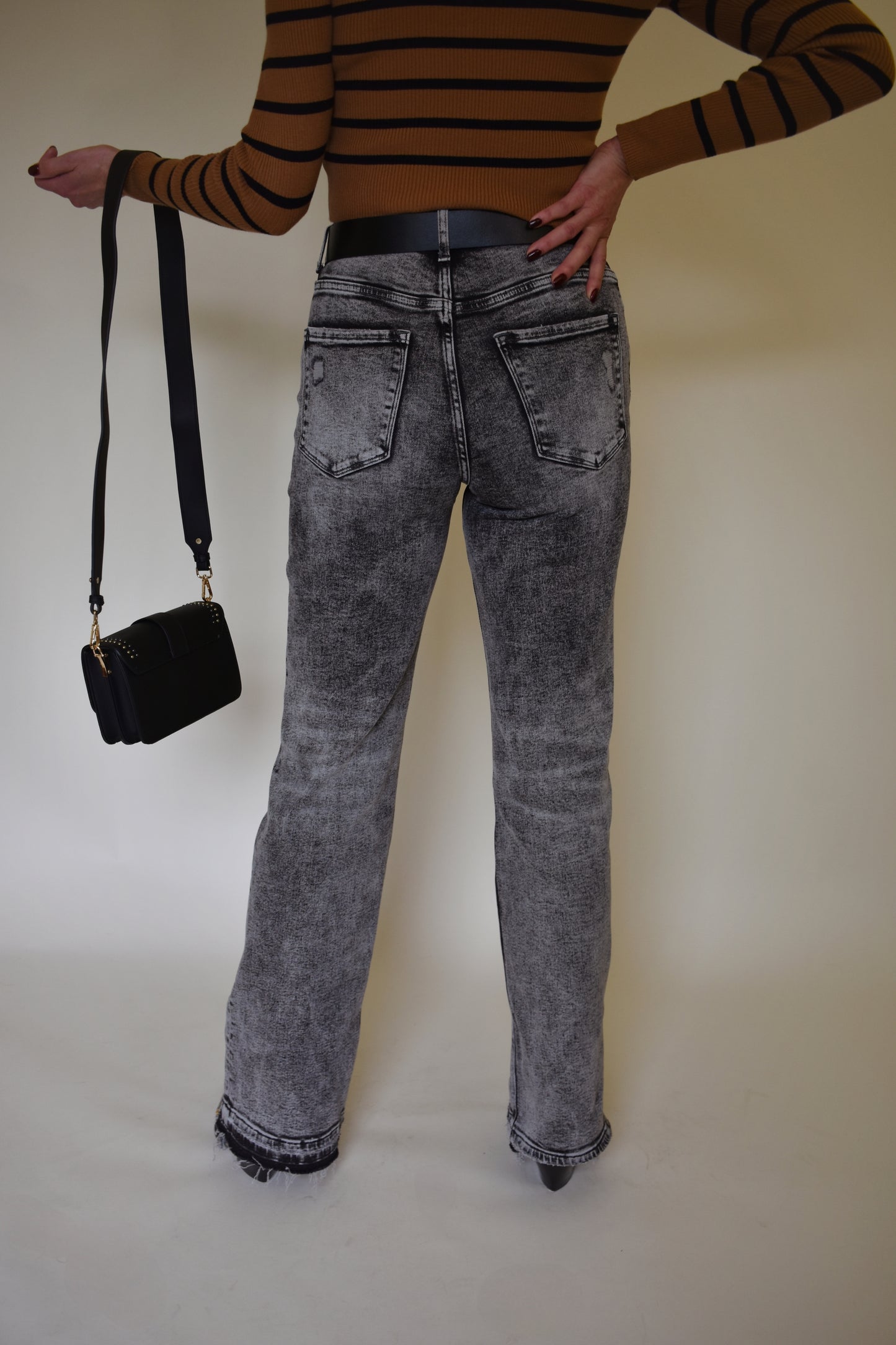 flared stretch denim jeans with gray and black acid wash high rise