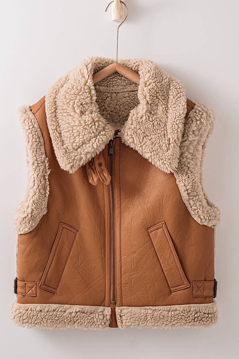 ivory sherpa lined faux camel colored leather moto vest with fold over collar, sherpa exposed along hem and collar, zip enclosure, has pockets, slightly cropped