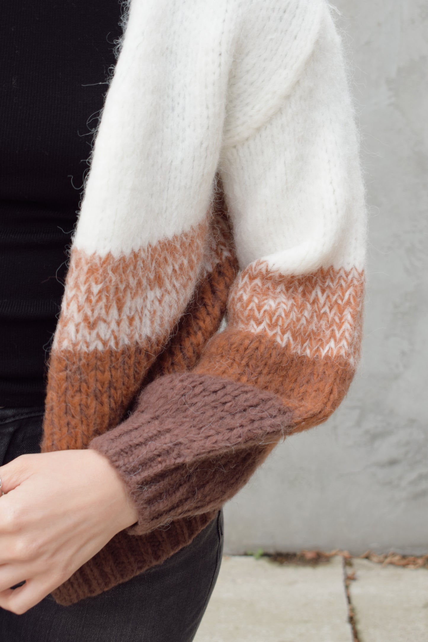 cozy relaxed fit cardigan with bottom half color blocked with earthy tones, white on top drop shoulder ribbed hem full length
