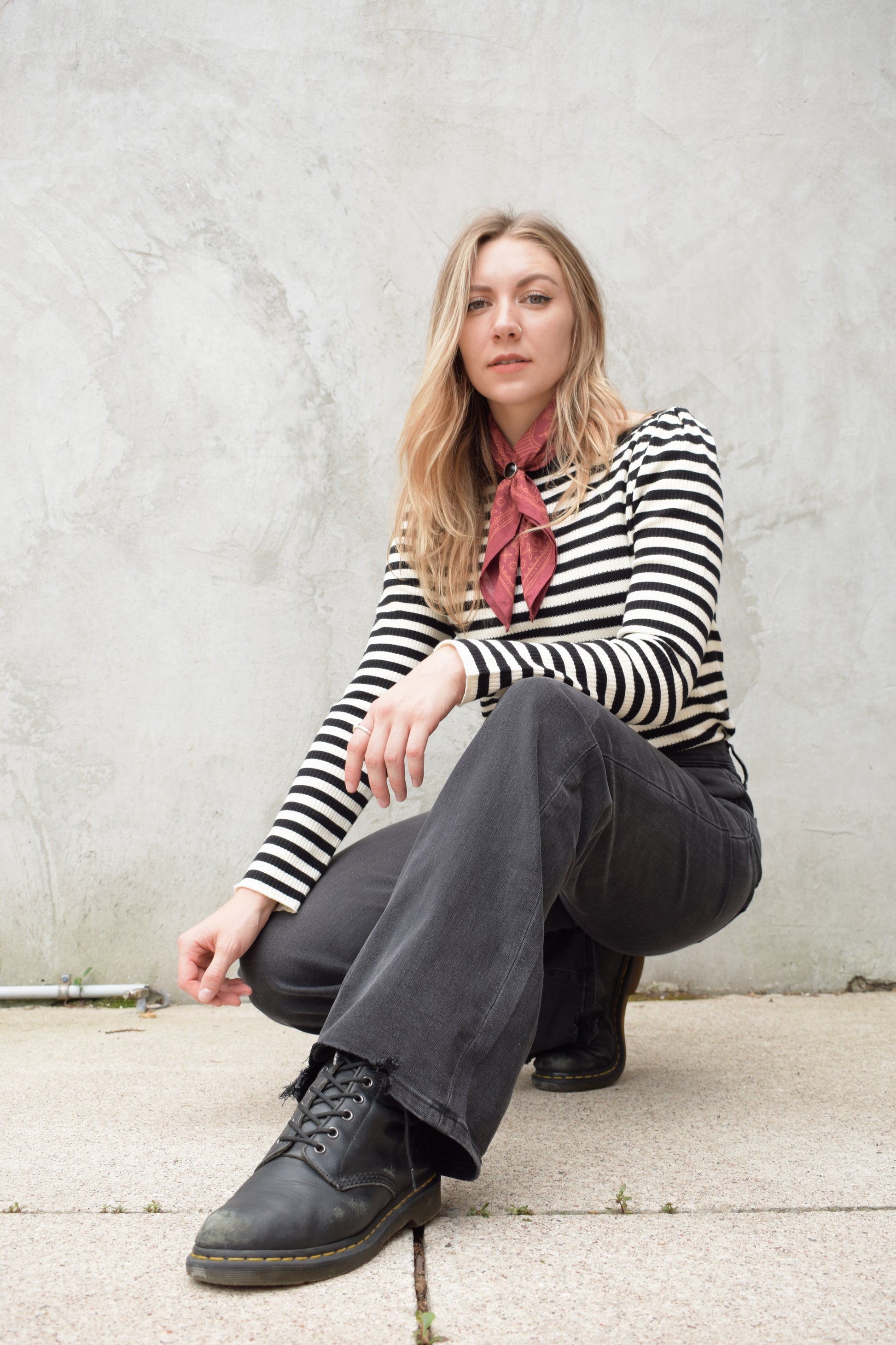 high rise washed black wide leg flare jeans full length stretch denim distressed hem but no holes zip and button enclosure has beltloops has front and back pockets