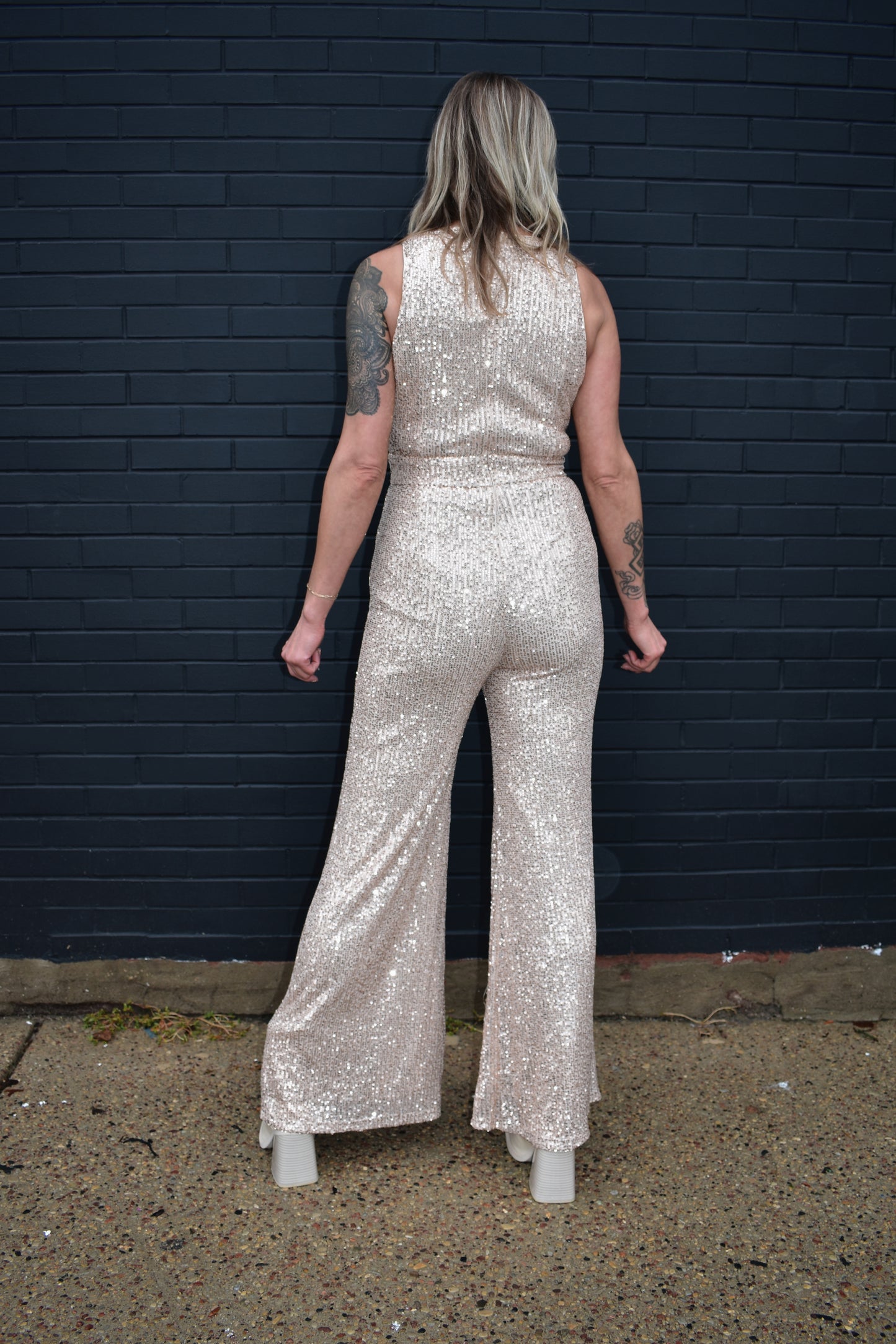 Full sequin rose gold jumpsuit, sleeveless, crew neck, back zipper enclosure, waist band detail, wide leg.