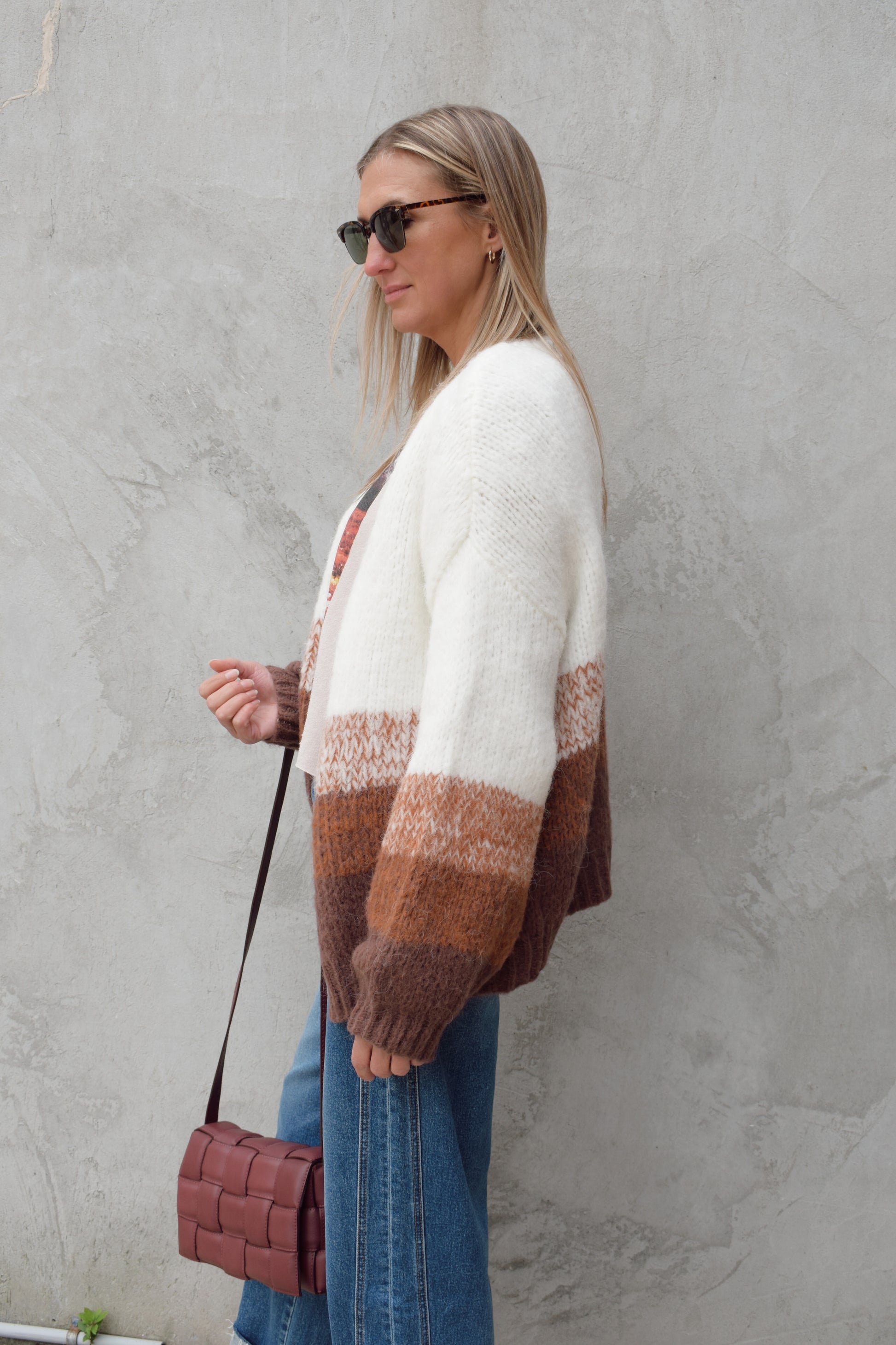 cozy relaxed fit cardigan with bottom half color blocked with earthy tones, white on top drop shoulder ribbed hem full length