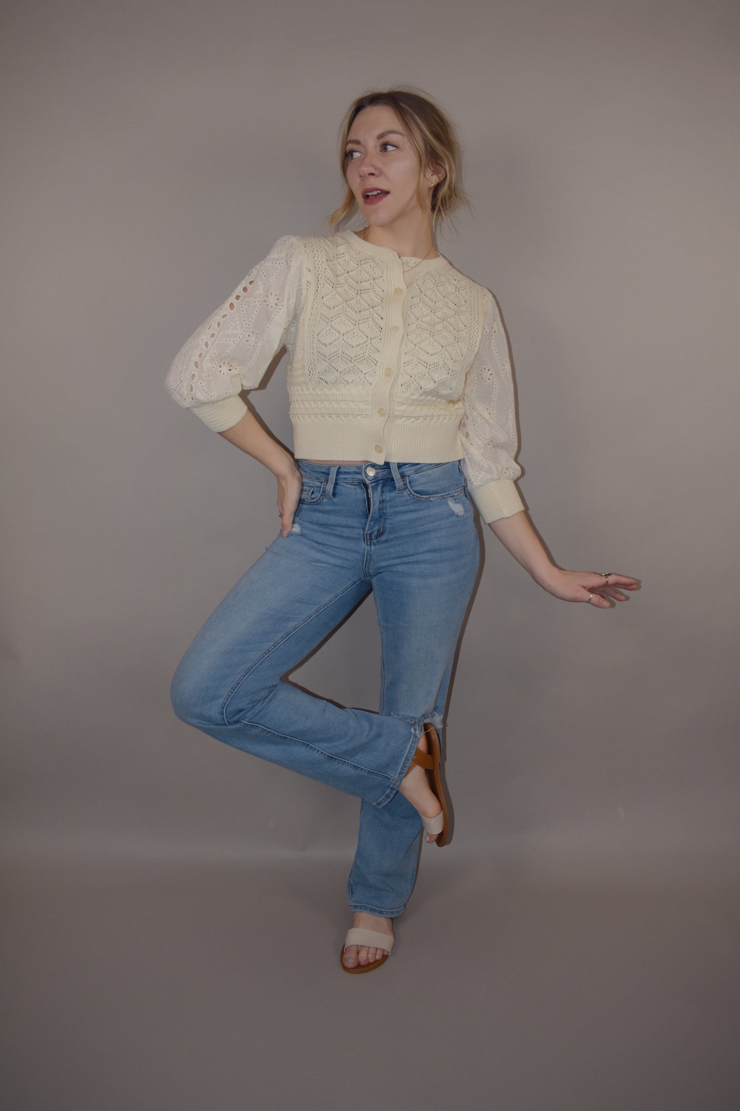 cropped button down top, round neck, 3/4 sleeves, crochet stitching on bodice, lace sleeves, knit cuffs and hem. super charming and unique