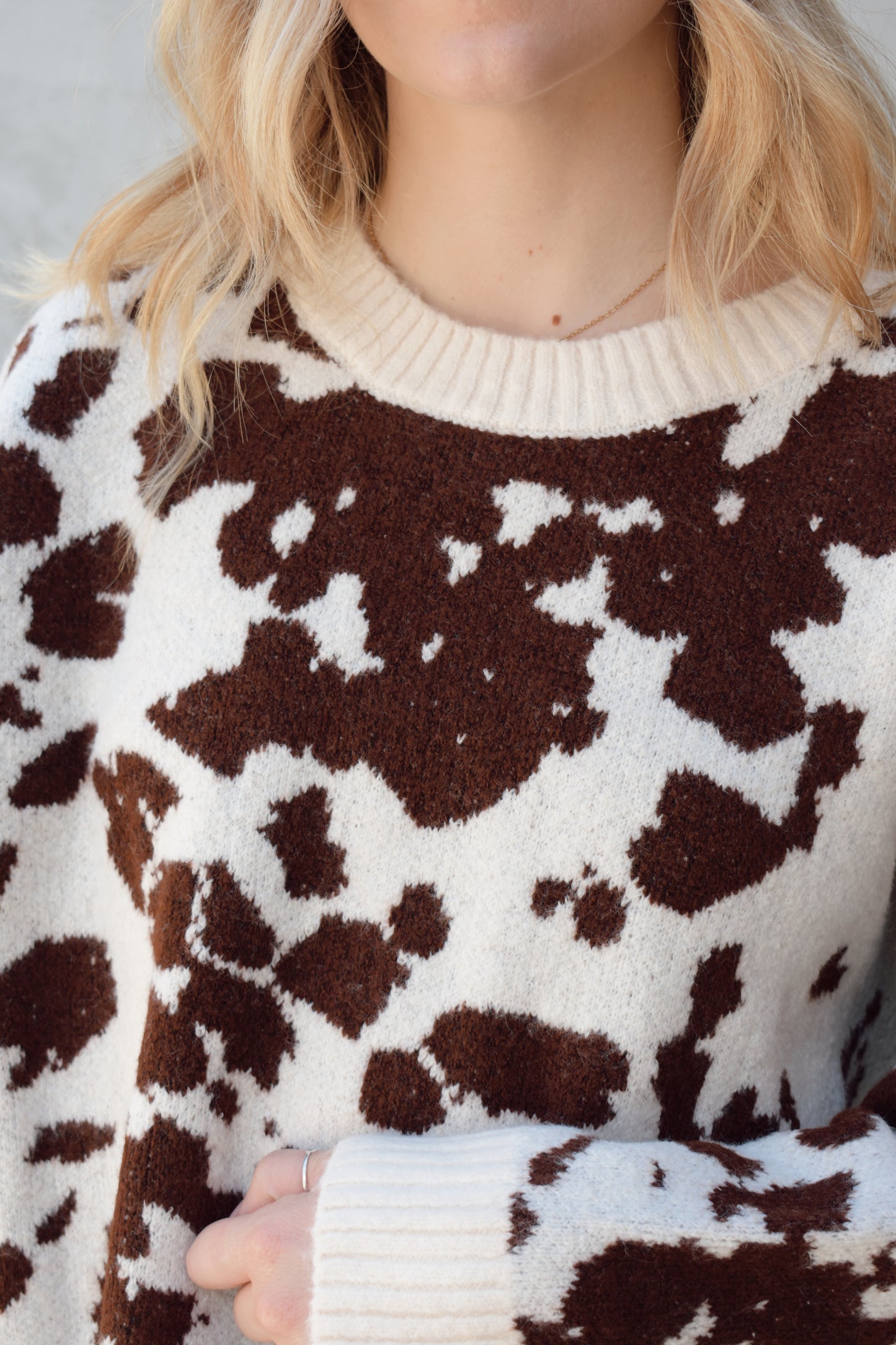 soft oversized cow hide print sweater with crewneck, ribbed neckline hem and cuffs, drop shoulder, very cozy and relaxed not heavy