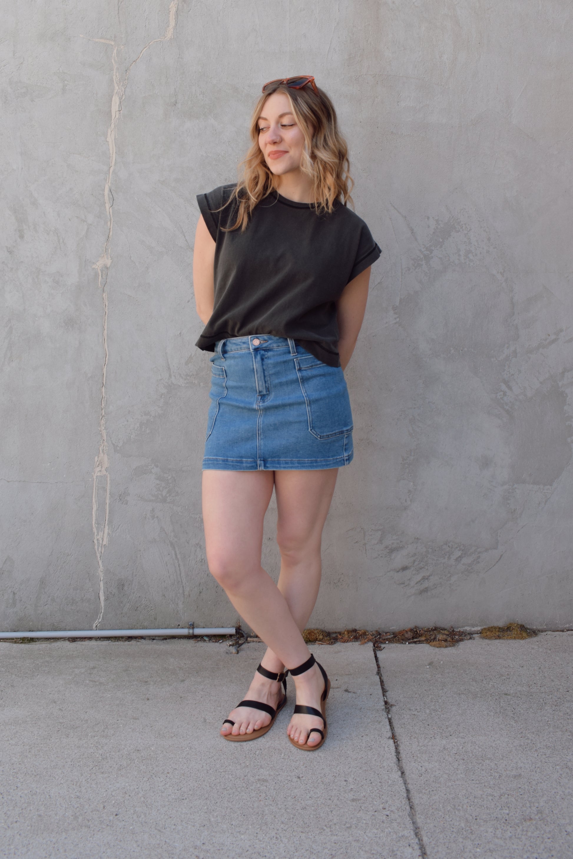 mini medium wash denim skirt stretch denim with big side patch pockets zip and button enclosure no distressing has beltloops