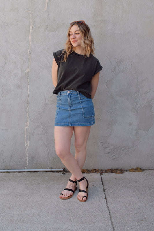 mini medium wash denim skirt stretch denim with big side patch pockets zip and button enclosure no distressing has beltloops