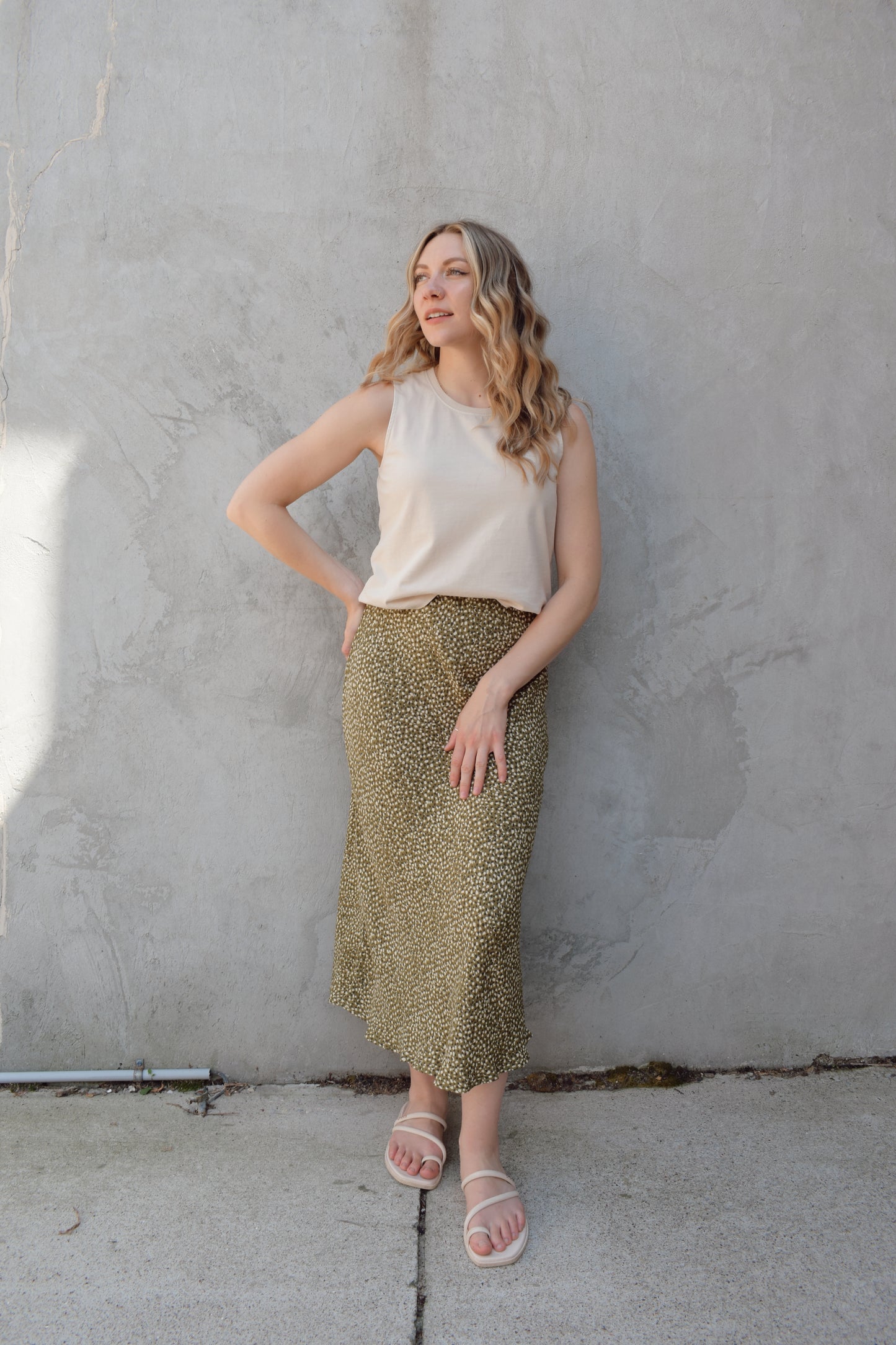 lightweight midi skirt with elastic waistband, no pockets, olive green background with black and cream dotted pattern