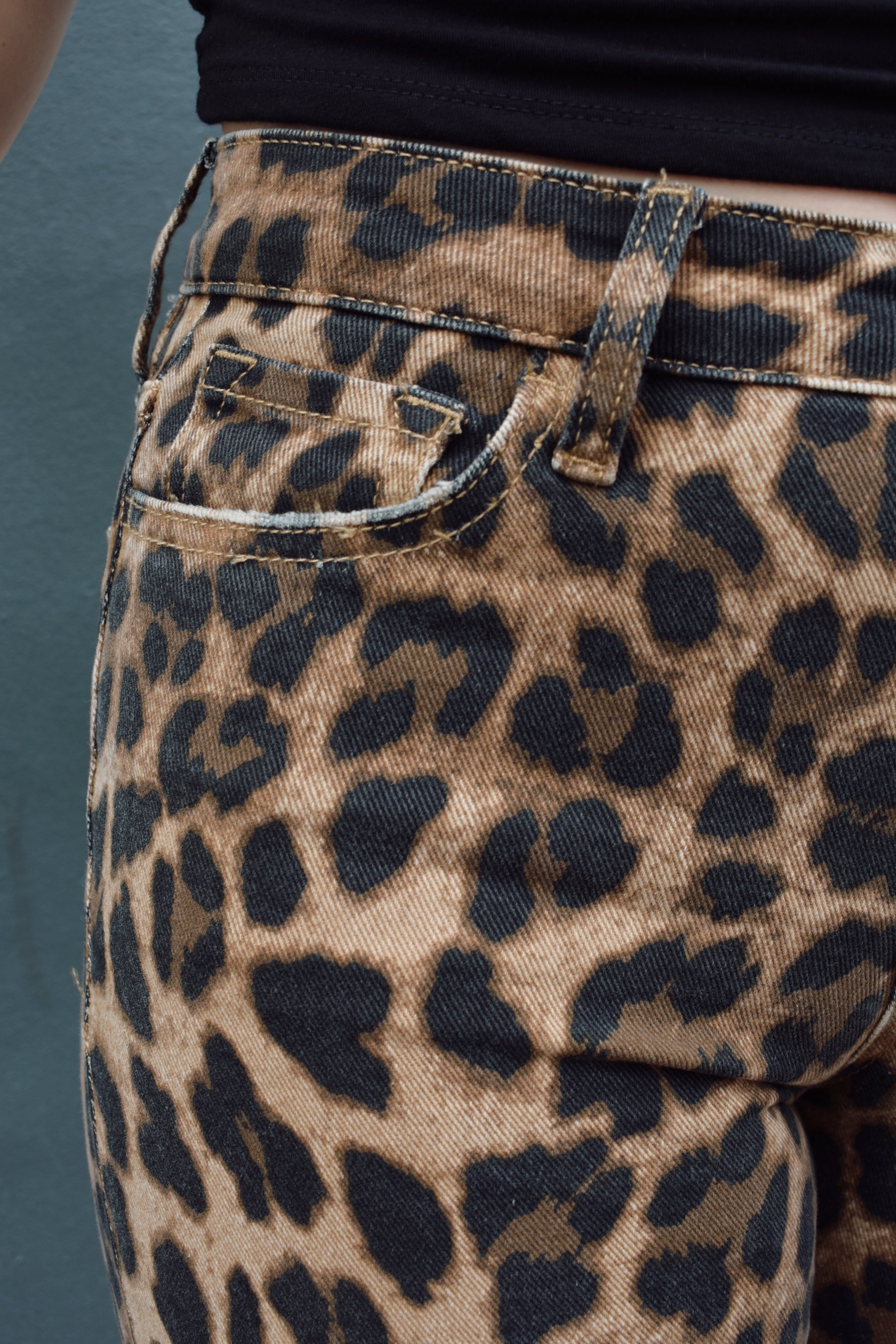 high rise cropped kick flare leopard print jeans, stretch denim, no holes, zip and button enclosure, statement jeans, animal print, front and back pockets, has beltloops