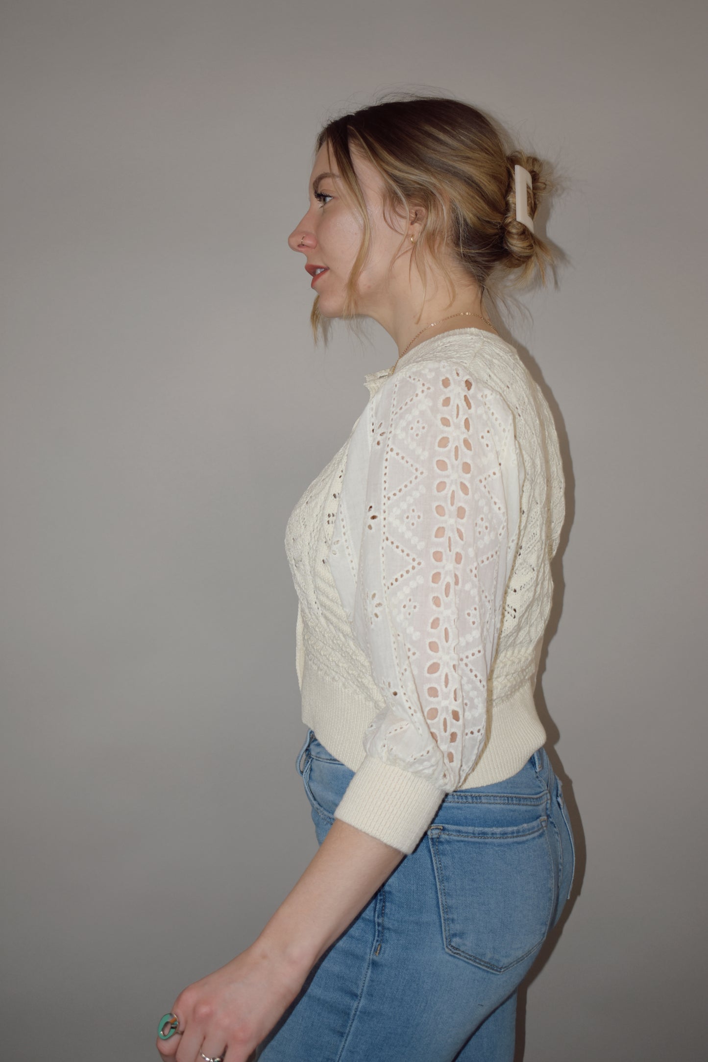 cropped button down top, round neck, 3/4 sleeves, crochet stitching on bodice, lace sleeves, knit cuffs and hem. super charming and unique