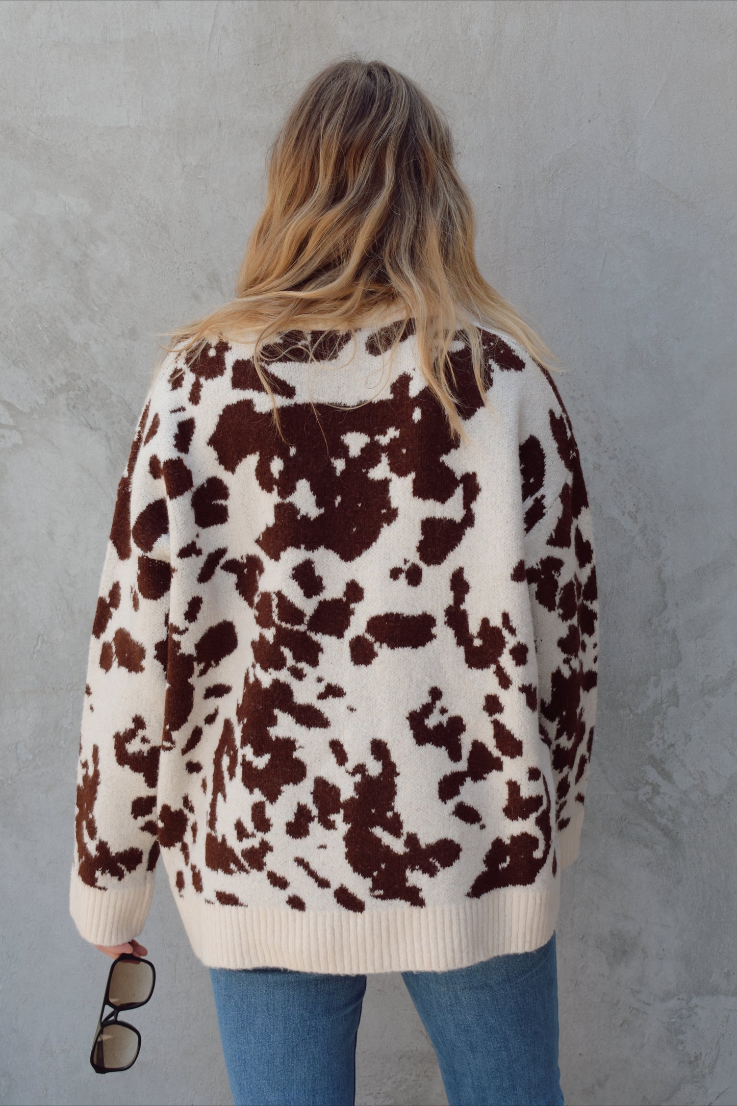 soft oversized cow hide print sweater with crewneck, ribbed neckline hem and cuffs, drop shoulder, very cozy and relaxed not heavy