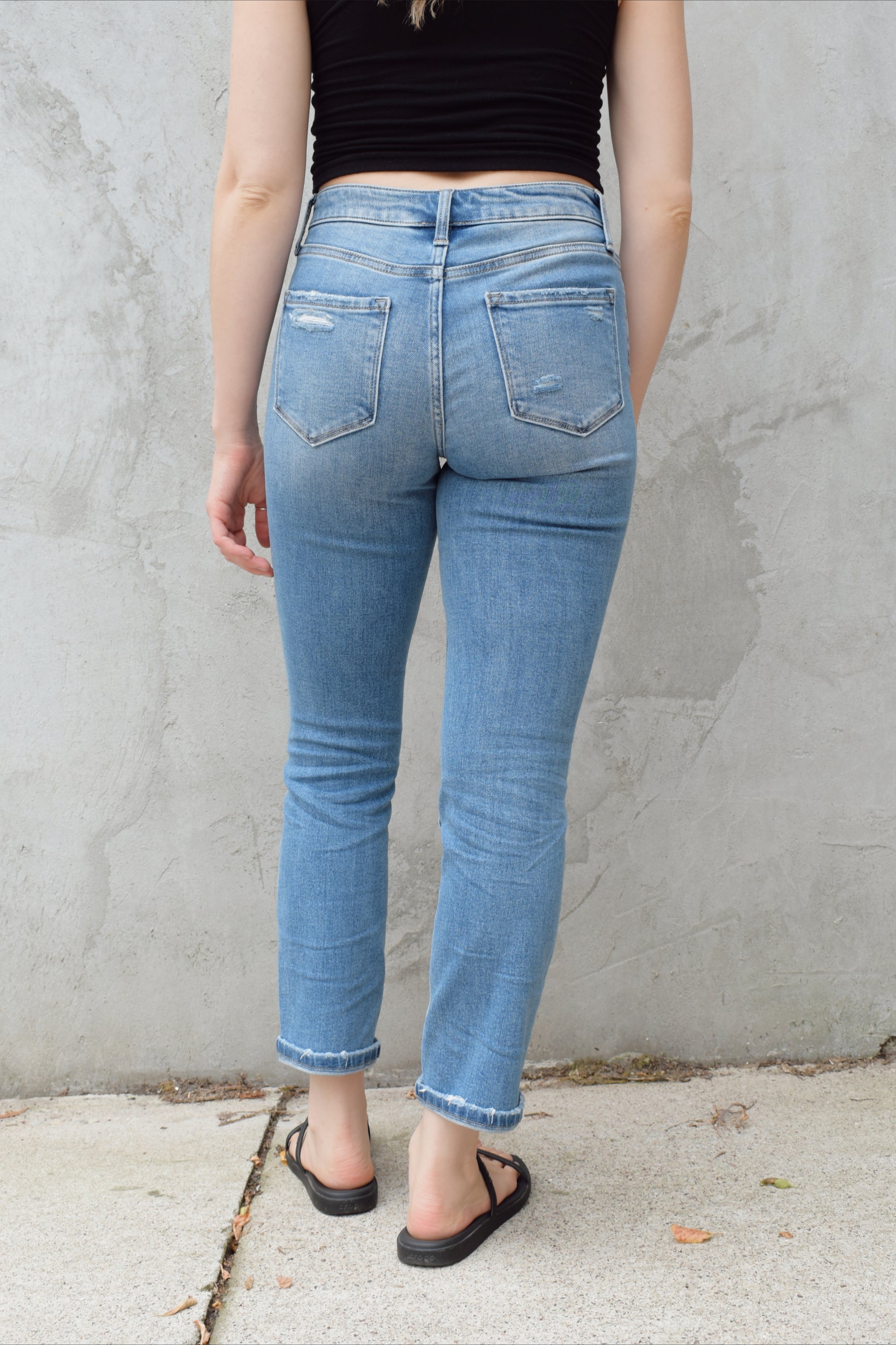 light wash stretch denim slim straight jeans no holes zip and button enclosure high rise