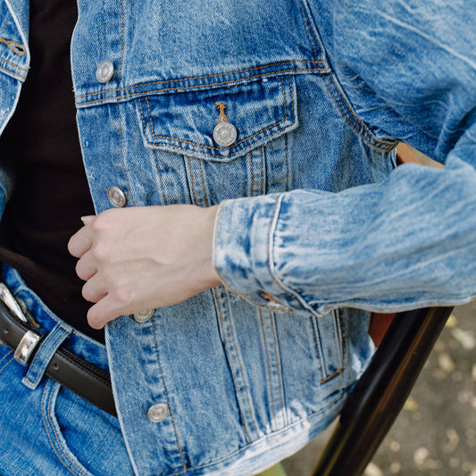 medium wash distressed jean jacket staple for wardrobe relaxed fit full length
