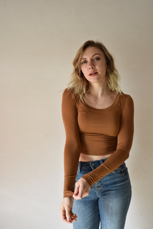 brown long sleeve fitted crop top with scoop neck and stretchy fabric