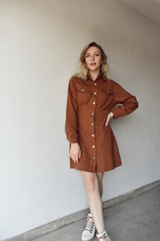 twill rust brown long sleeve utility dress flap breast pockets, collar, button down front and drop shoulders, slightly loose fitting