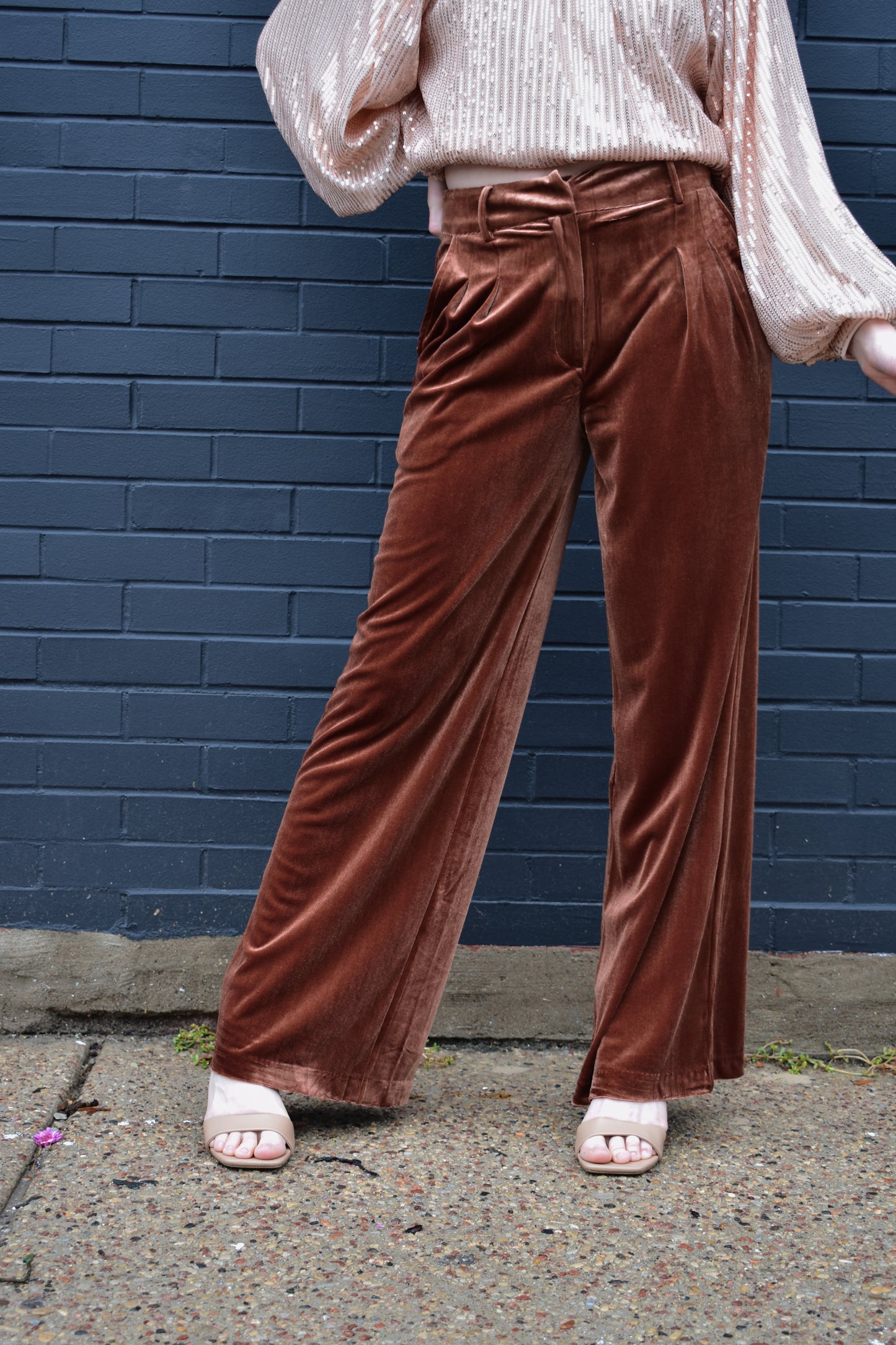 dark copper velvet trousers with front pleats by pockets, front zip and clasp enclosure, pockets, fake back pockets, wide leg, beltloops.