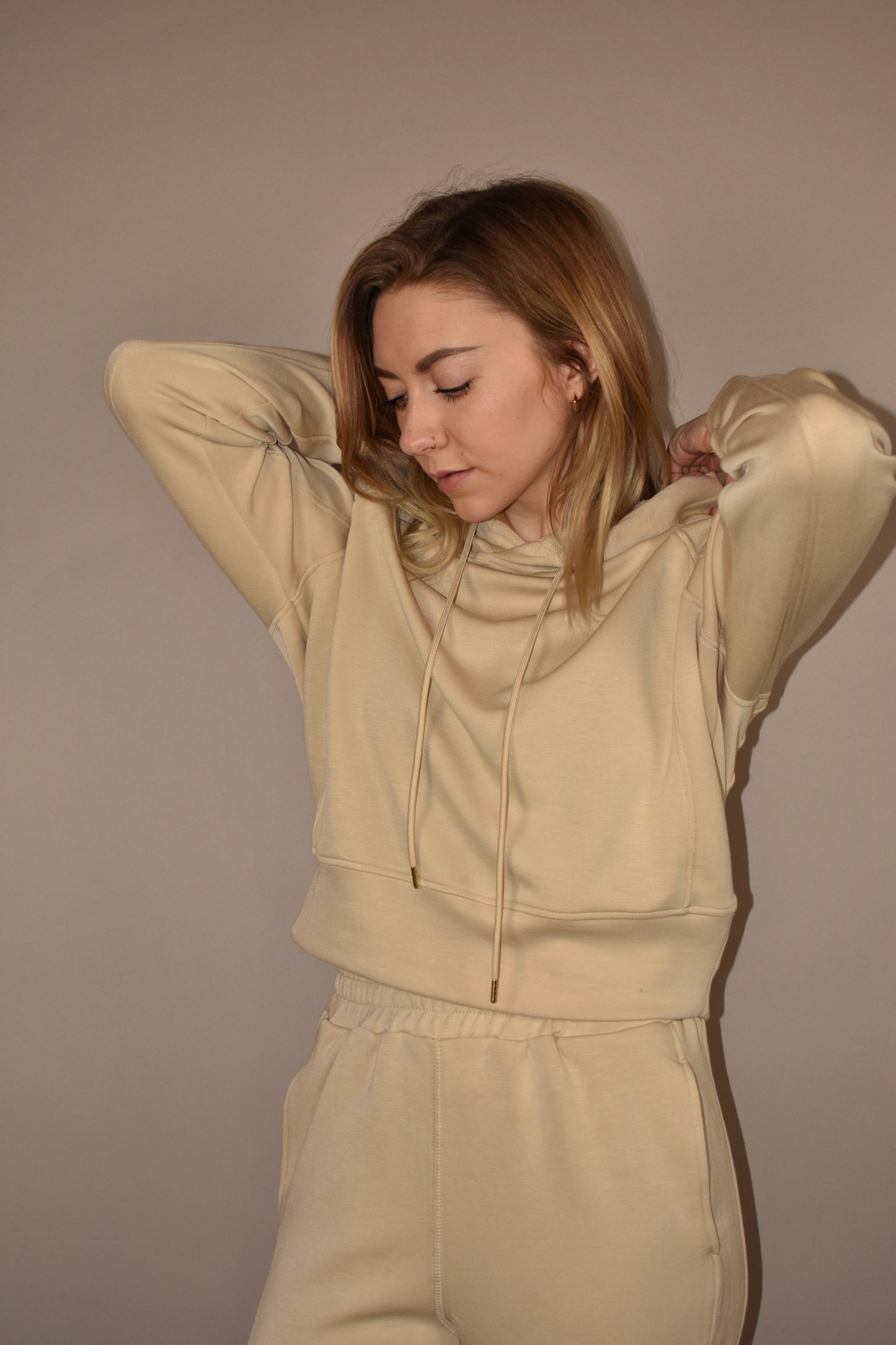 crazy soft hoodie with drawstrings with gold tips and its between cropped and full length