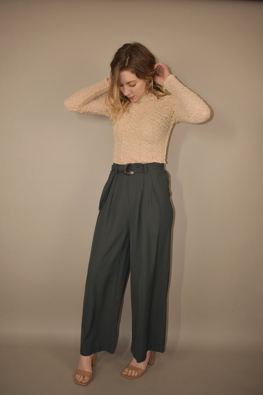 Wide leg pleated full length trousers with side pockets and an o ring knot belt. 