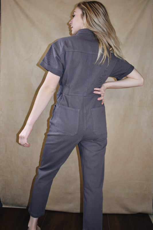 Short sleeve button down engineer style jumpsuit with pockets and elastic waistband Listicle the revival