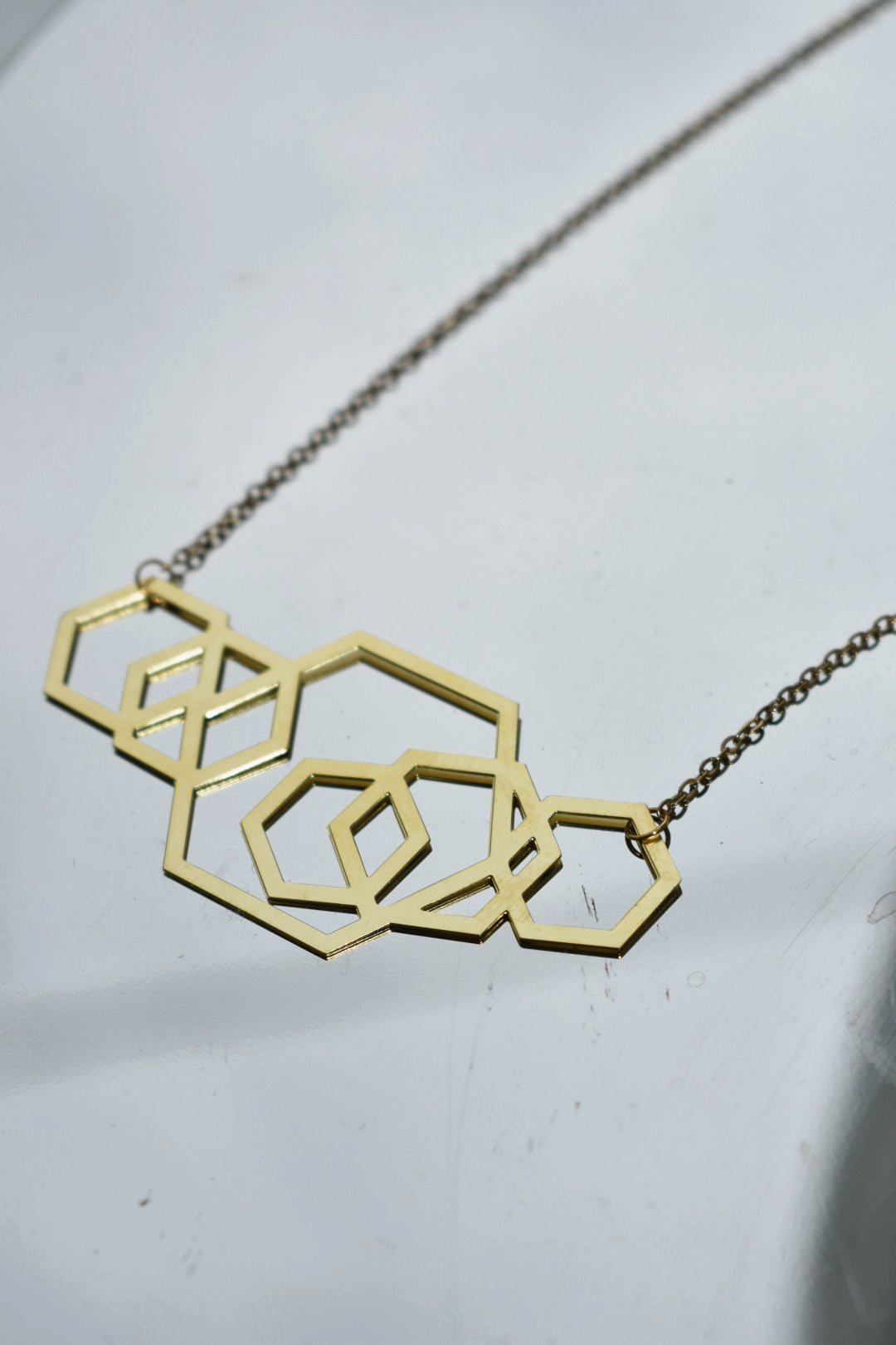 graduated hexagon laser cut brass pendant necklace 18" gold 