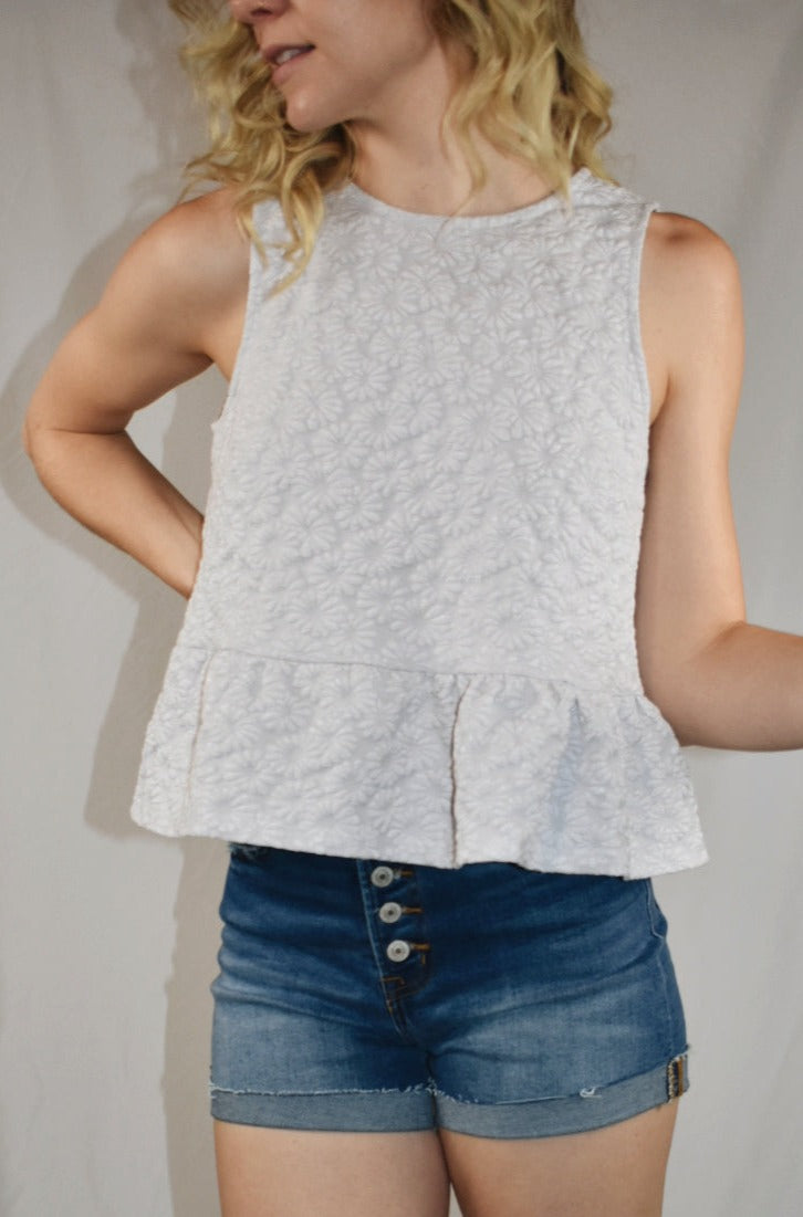 daisy textured jacquard top keyhole back with button and a ruffle hem at the bottom Mittoshop the revival