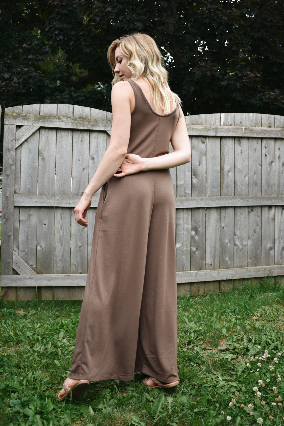scoop neck tank jumpsuit in mocha with wide legs and pockets. Made with french terry knit fabric and is loose fitting. The brand is Mittoshop.