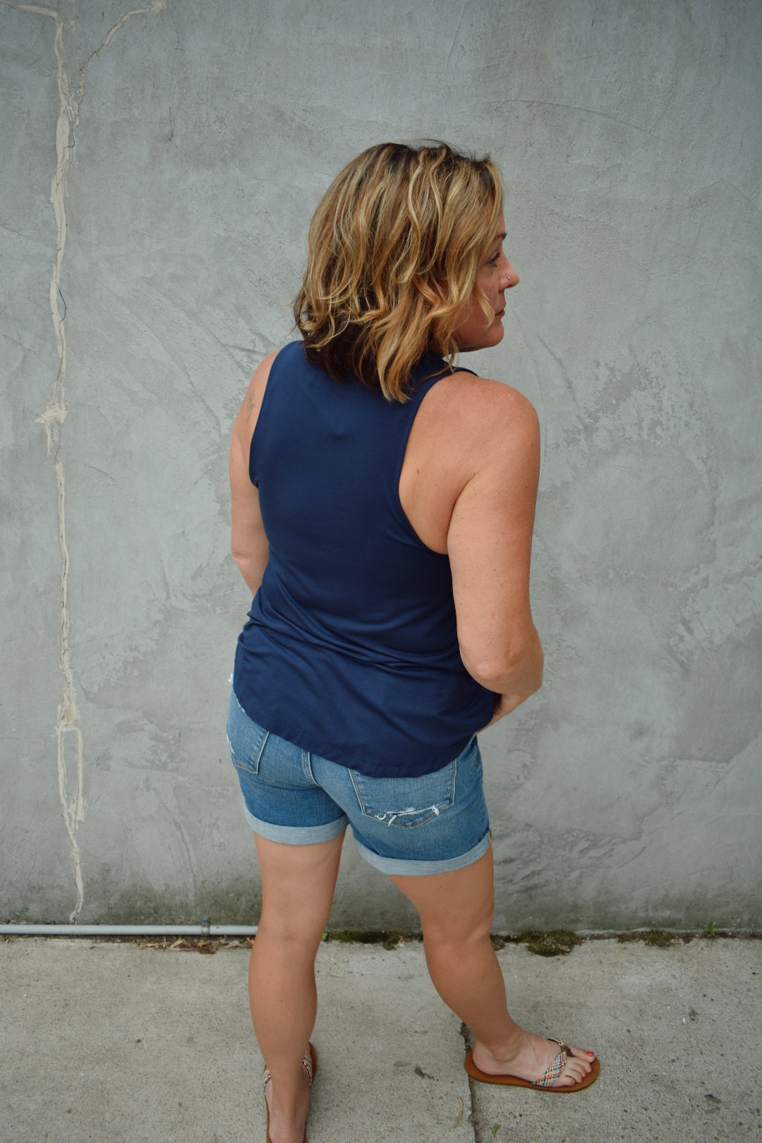 Lightweight navy tank crew neckline medium length hem. Brand is Hyfve