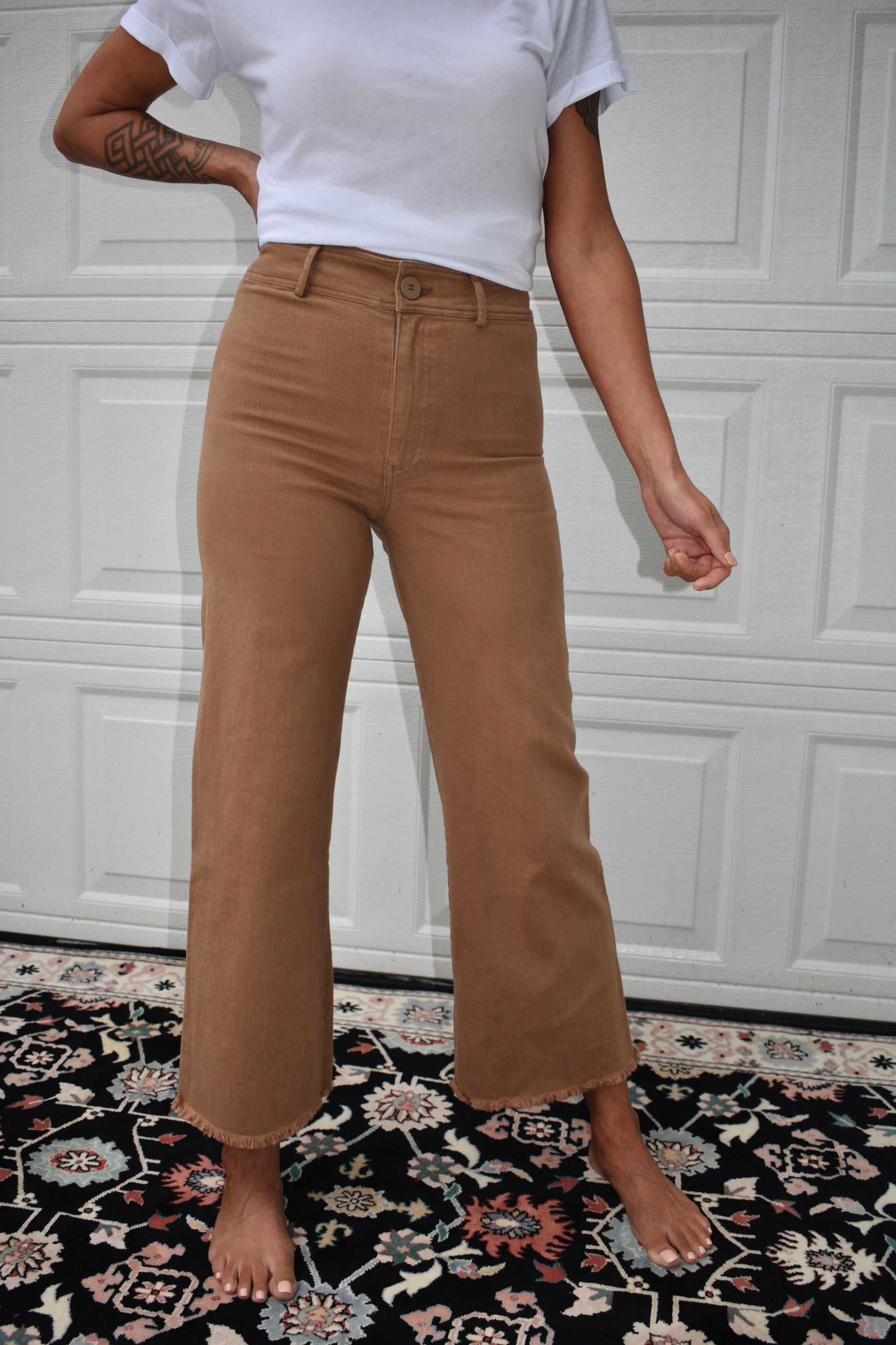 High waisted toffee colored denim pants. Wide leg, raw hem, back pockets, slightly cropped. Stretch denim with belt loops.The brand is miss love.