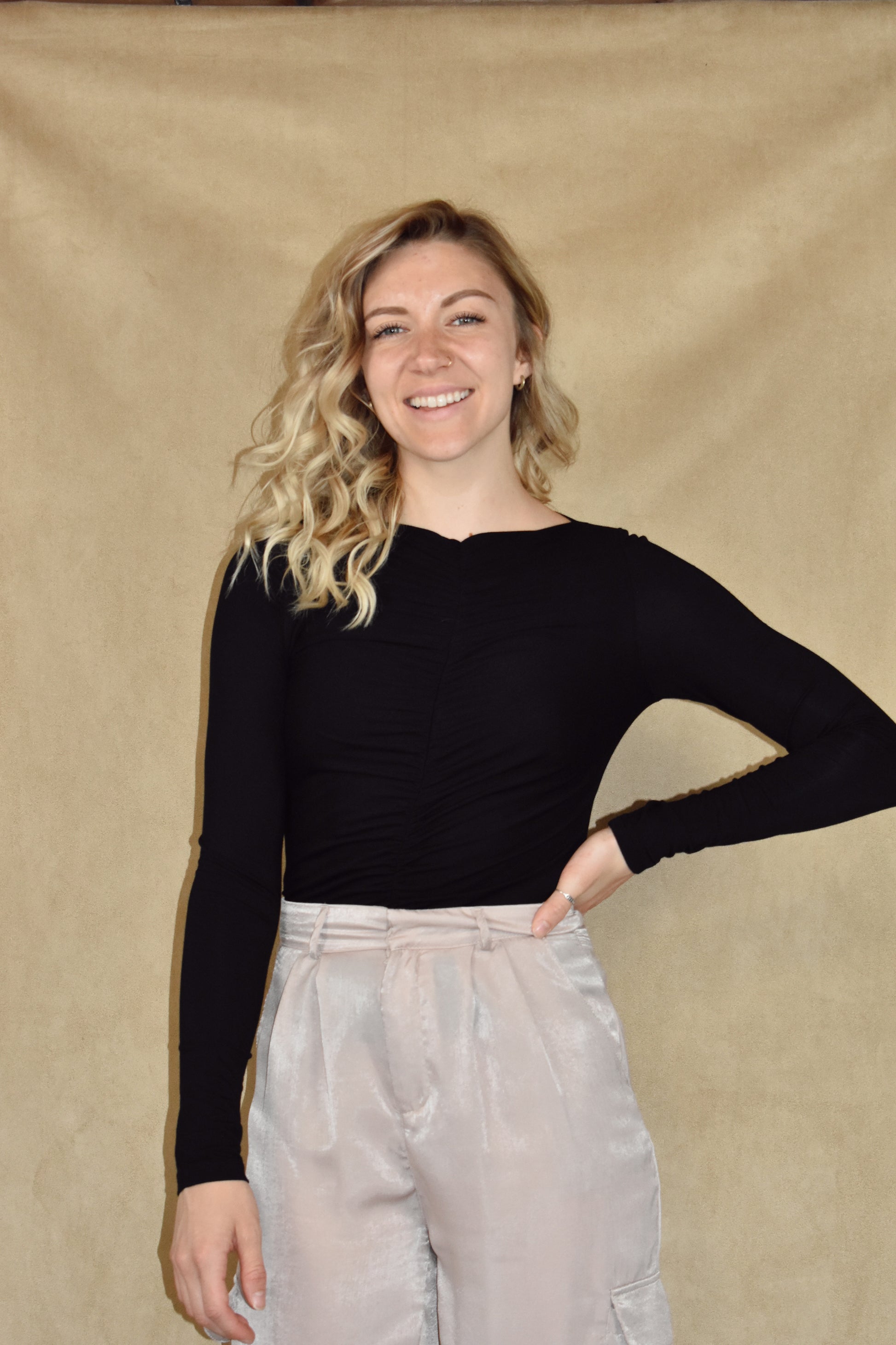 long sleeve full length fitted top with ruching down center of front and back and a boat neckline