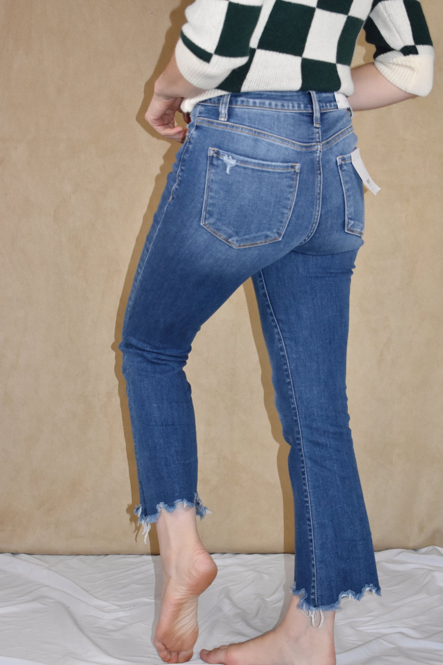 highwaisted cropped flare jeans. stretch denim with button fly and a raw hem. Vervet.
