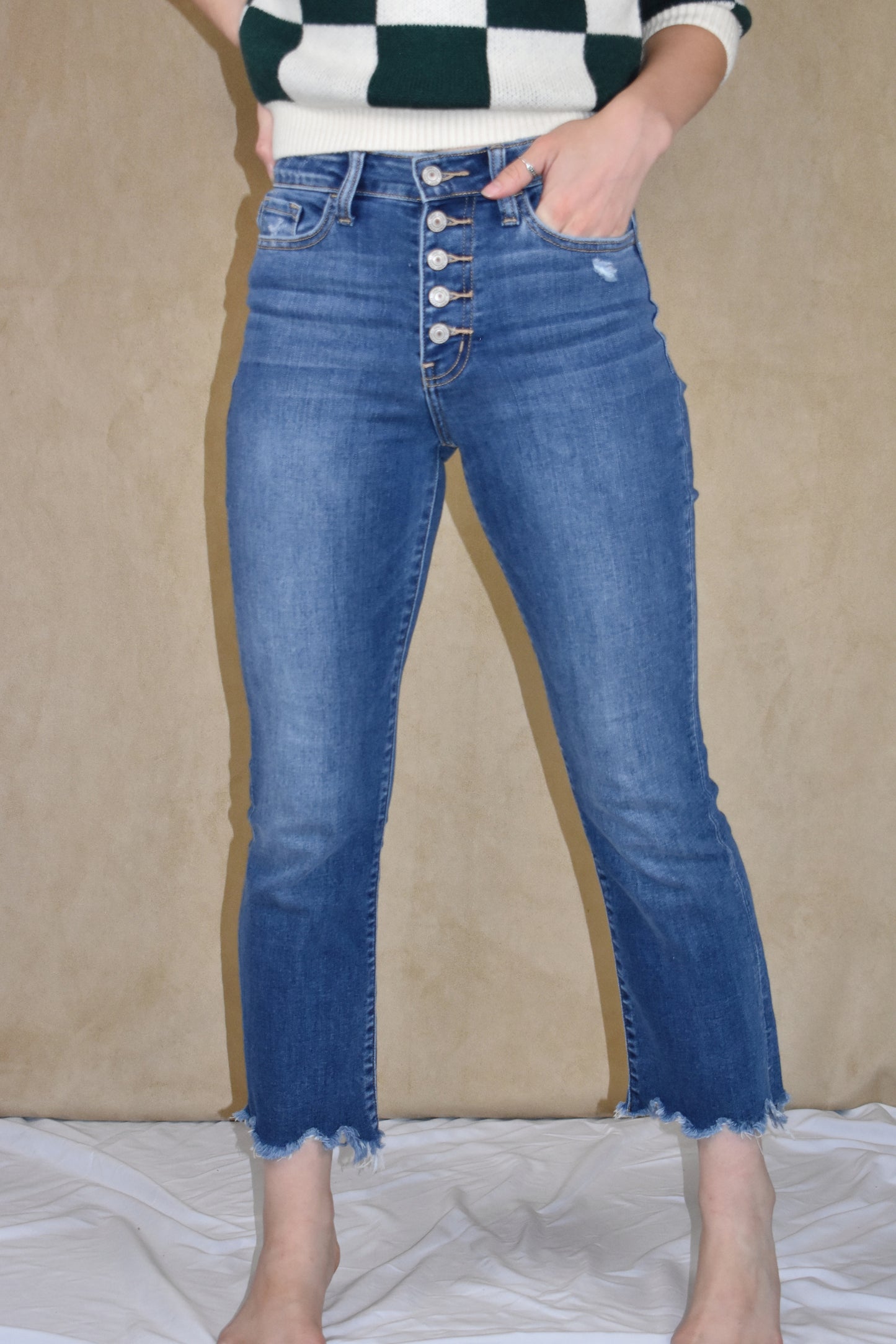 highwaisted cropped flare jeans. stretch denim with button fly and a raw hem. Vervet.