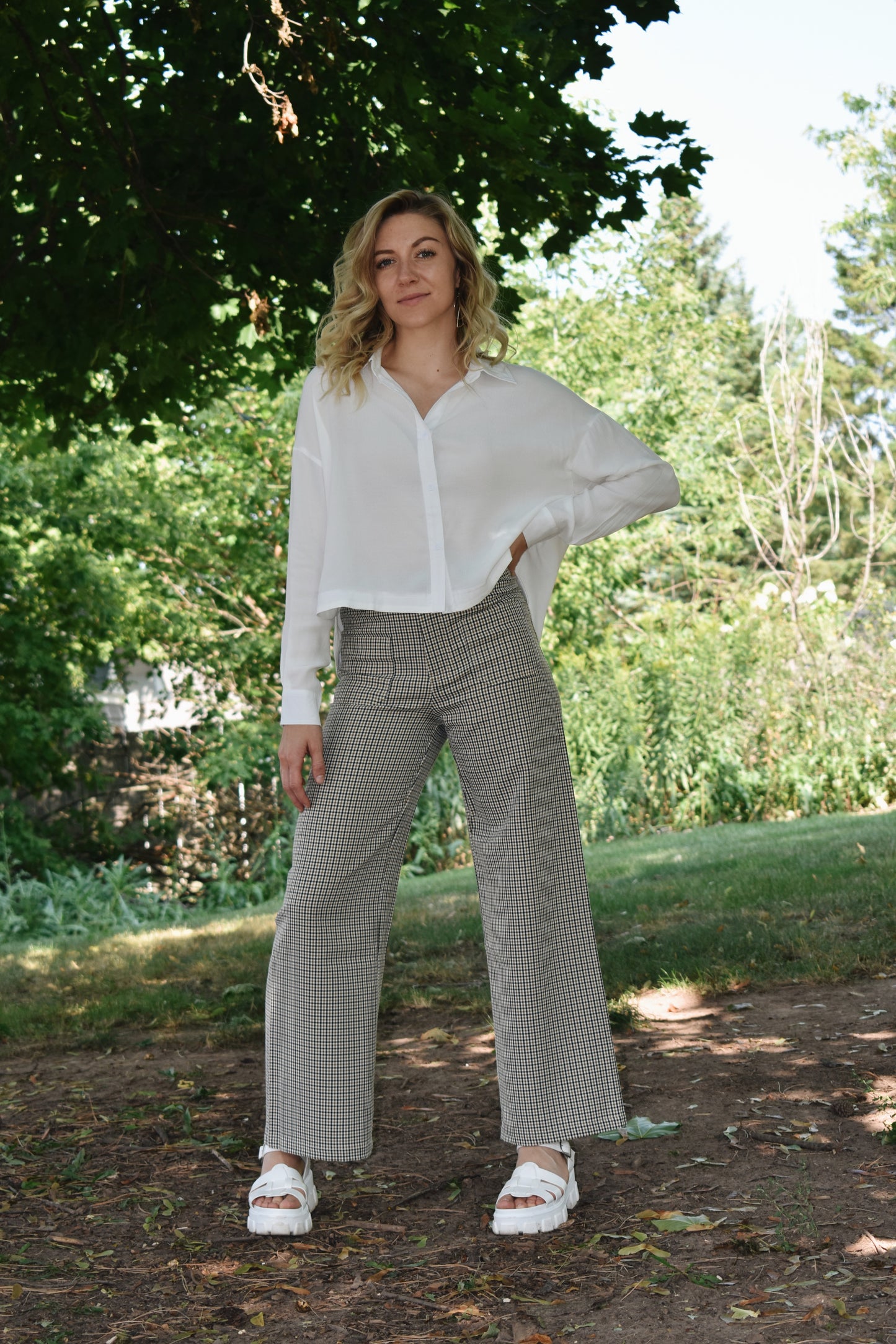 Black tan and white plaid wide leg pants with oversized front patch pockets high waisted with back pockets and a stretch fit.