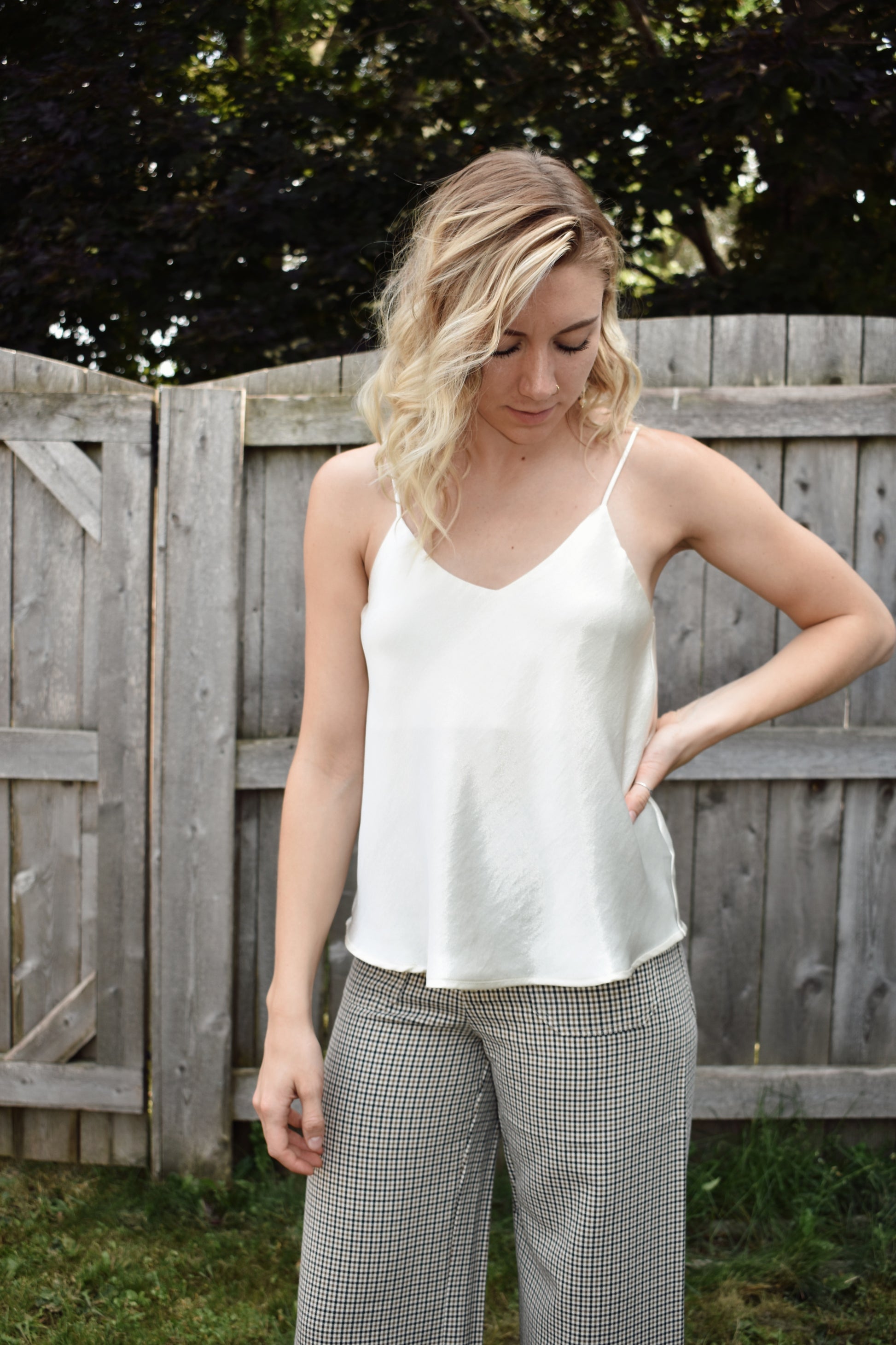 Ivory metallic sheen full length cami with adjustable spaghetti straps and a V neckline in the front and in the back 