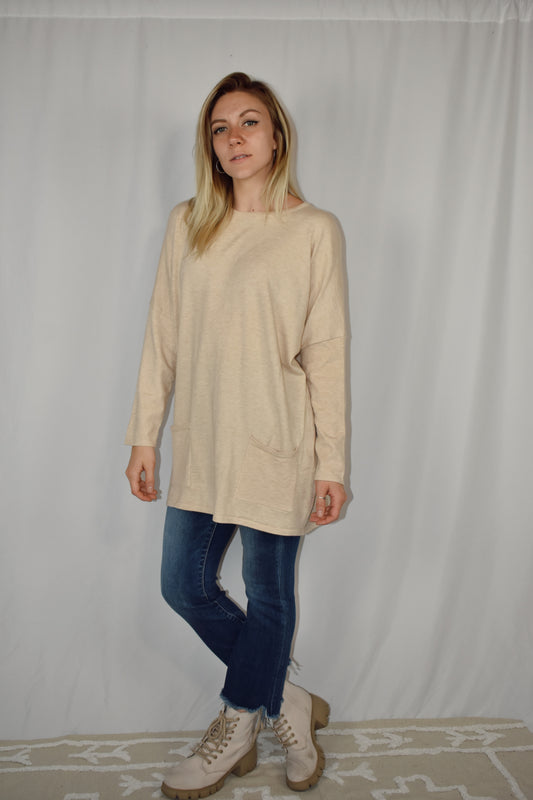 Oversized oatmeal colored sweater, lightweight fabric, scoop neck, front patch pockets, drop shoulders.