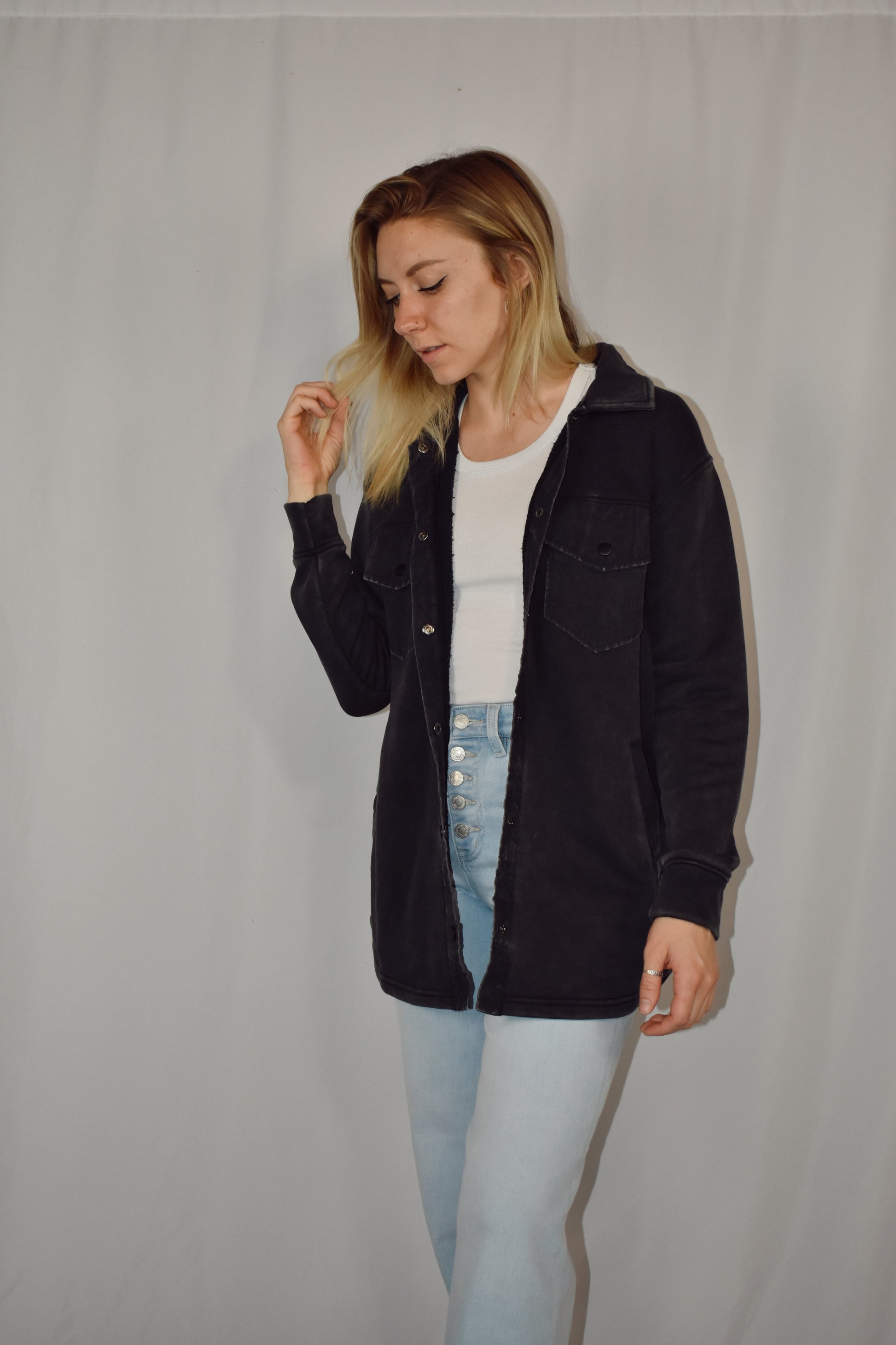 snap button down cozy shacket with two breast pockets, longline silhouette and slightly oversized fit.