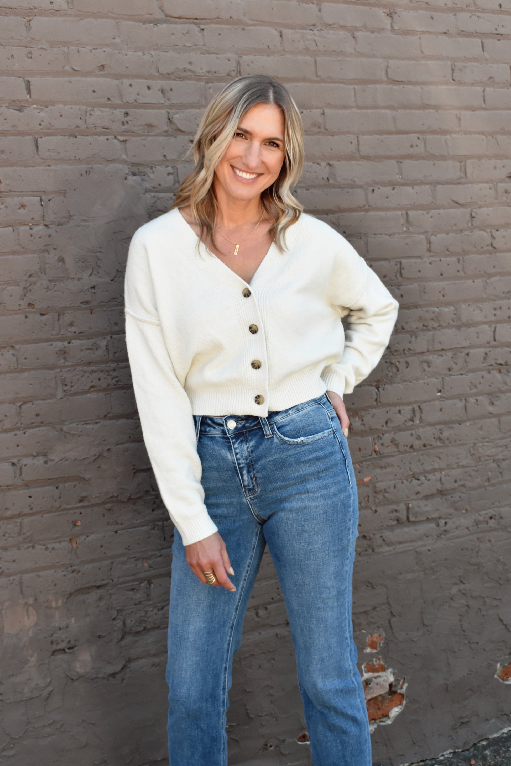 cropped v neck button front drop shoulder cardigan with ribbed cuffs and hem